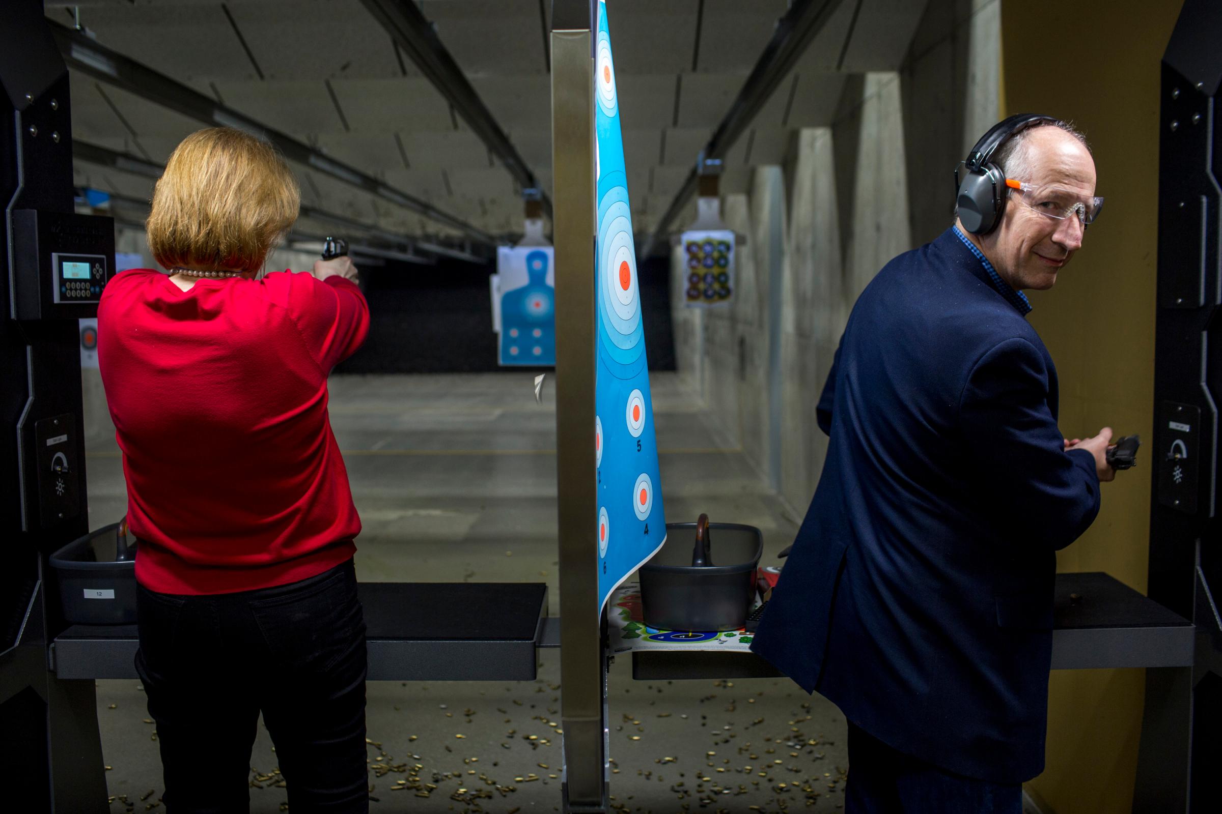 Former Arkansas Gov. Mike Huckabee and his wife Janet campaign at the Crossroads shooting range in Johnston, Iowa on Jan. 30, 2016.