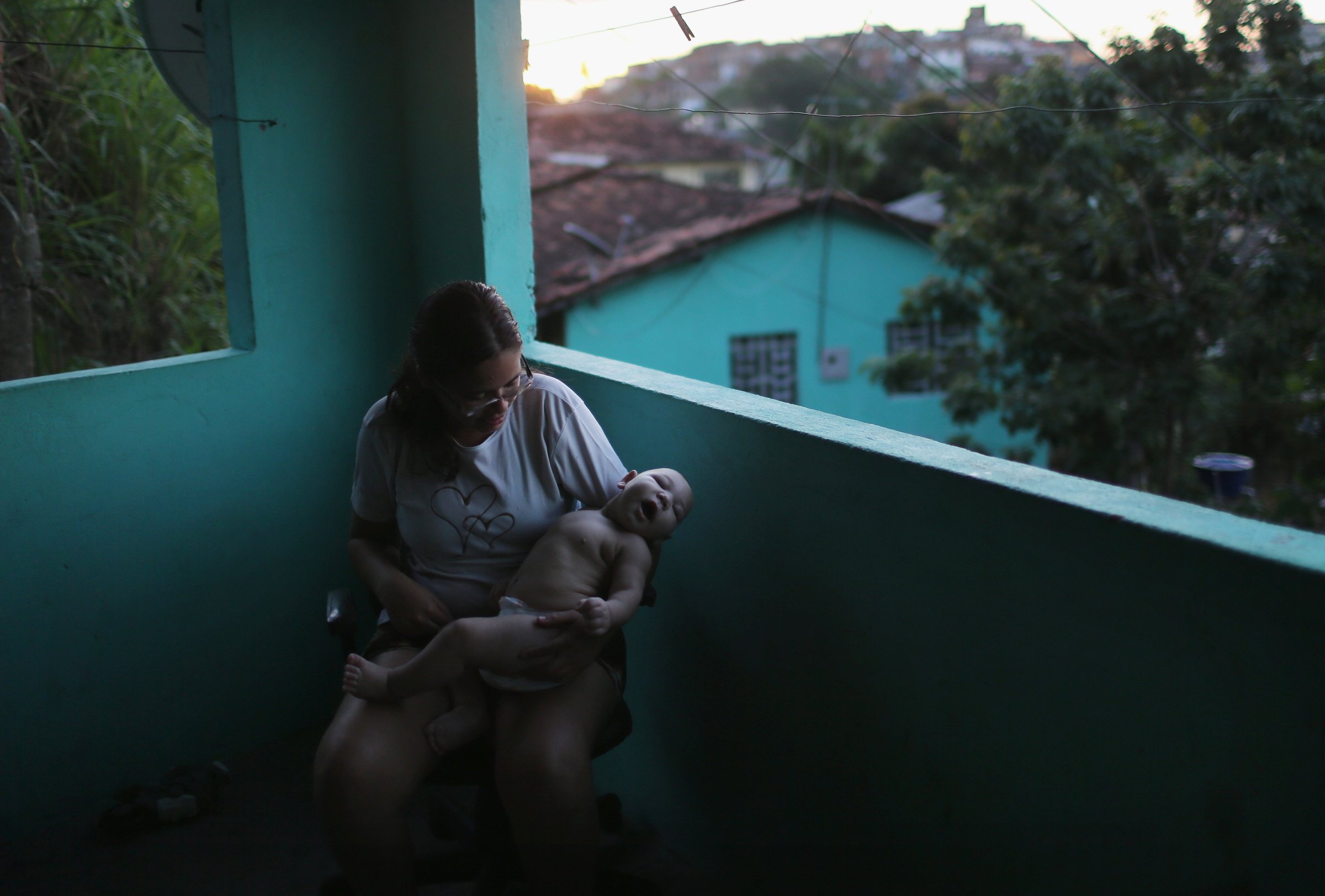 Mylene Helena Ferreira holds her five-month-old son David Henrique Ferreira, who has microcephaly, in Recife, Brazil, Jan. 25, 2016.