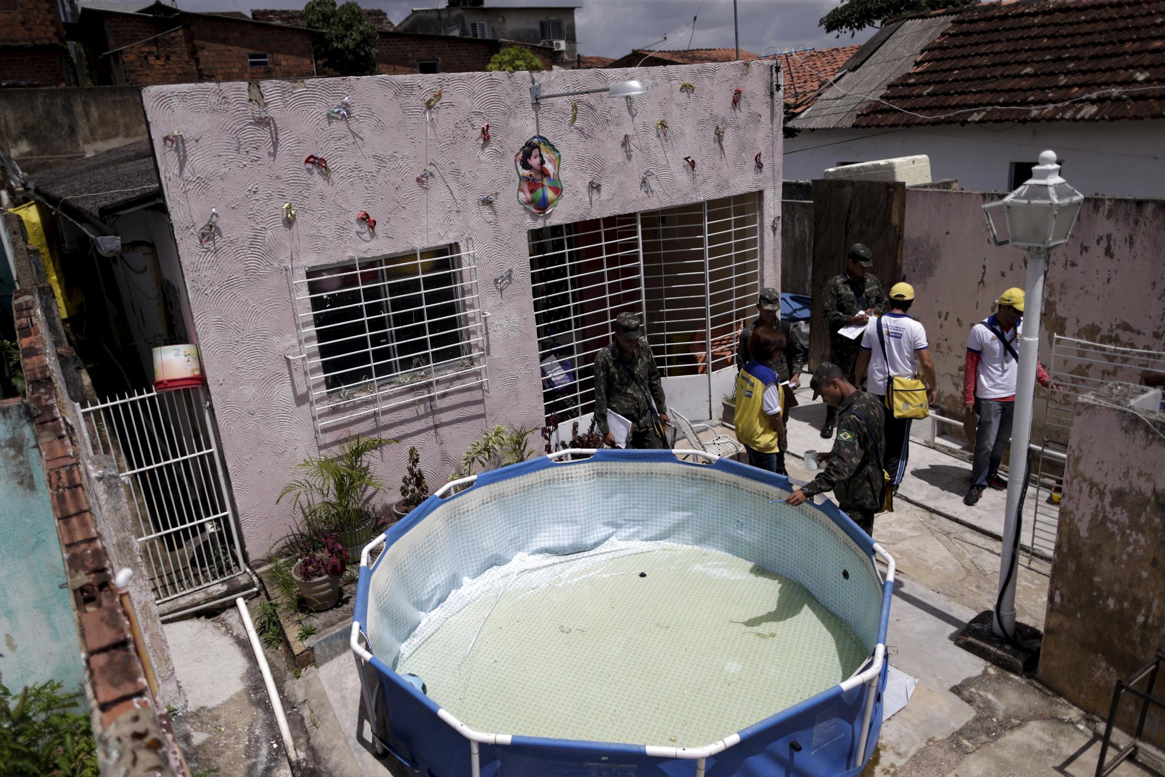 Soldiers inspect a house during an operation against the Aedes aegyti mosquito in Recife, Brazil, Jan. 27, 2016. Health authorities in the state at the center of a Zika outbreak have been overwhelmed by the surge of babies born with microcephaly, a neurological disorder associated with the mosquito-borne virus.