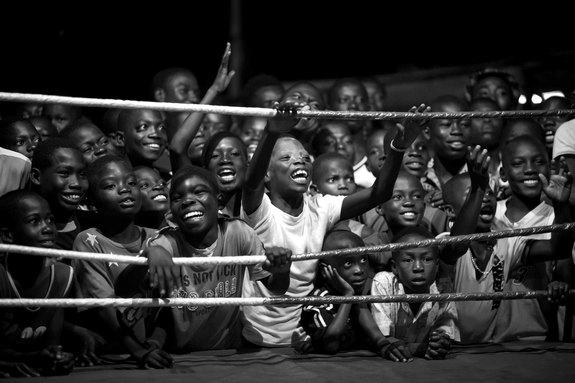 Young boys cheer at a boxing match in Bukom, a small neighborhood of Accra in Ghana, which has produced all of the country's world champions.