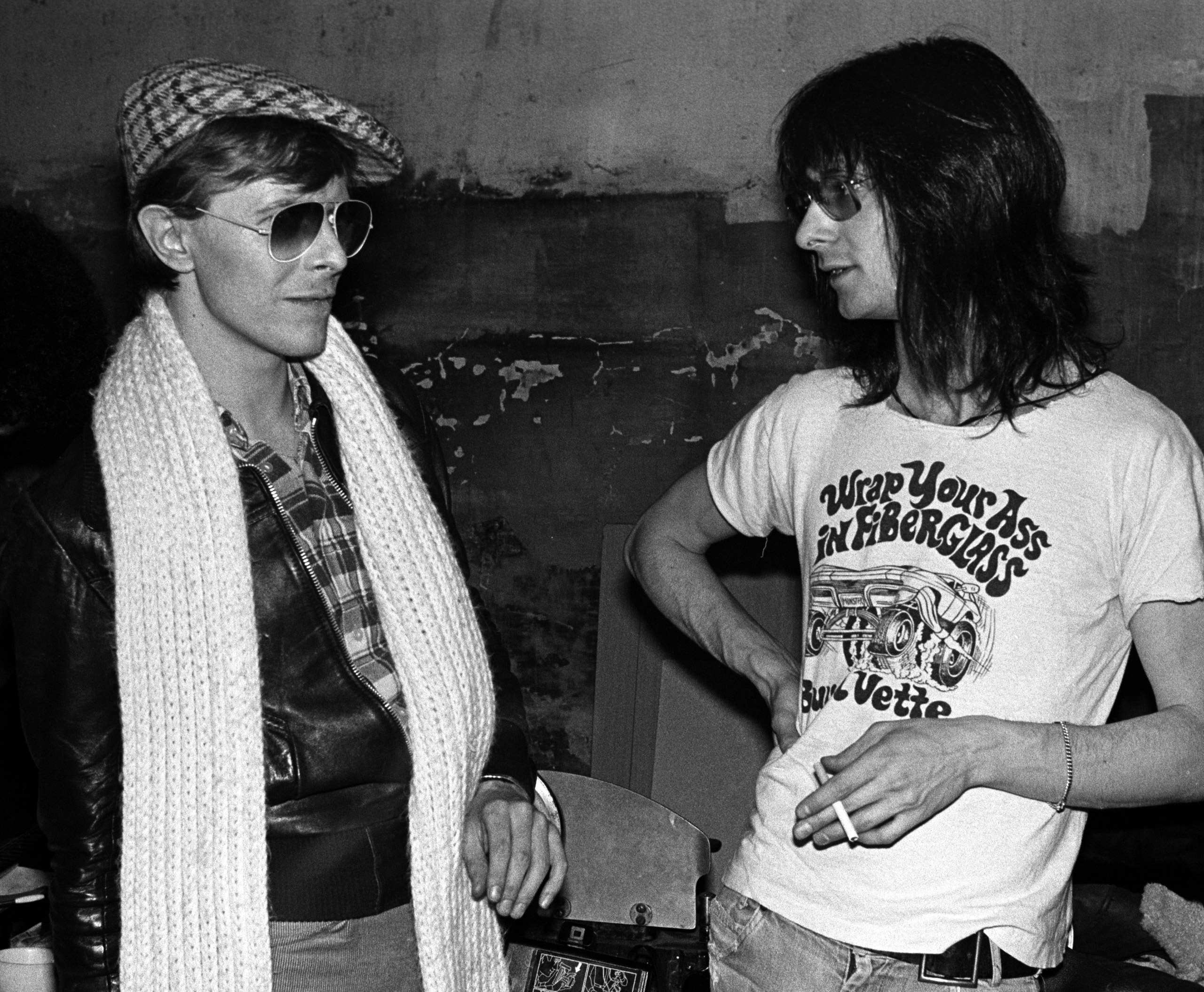 Lenny Kaye from the Patti Smith Group with David Bowie at CBGB's club in New York City on April 4 1975.