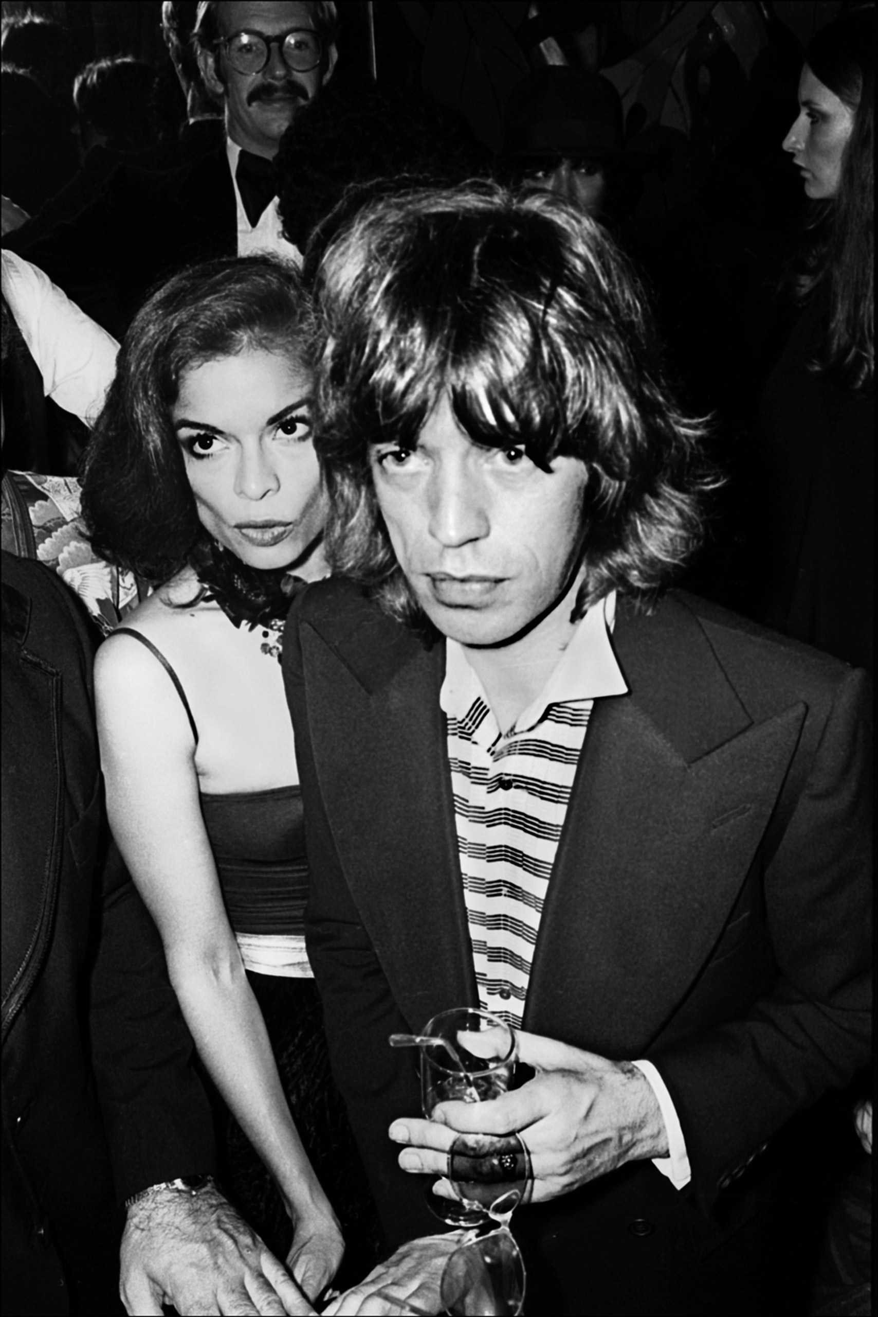 Mick Jagger and his wife Bianca arrive at the Andy Warhol-hosted re-opening party of the Copacabana nightclub, New York, N.Y., Oct. 13, 1976.