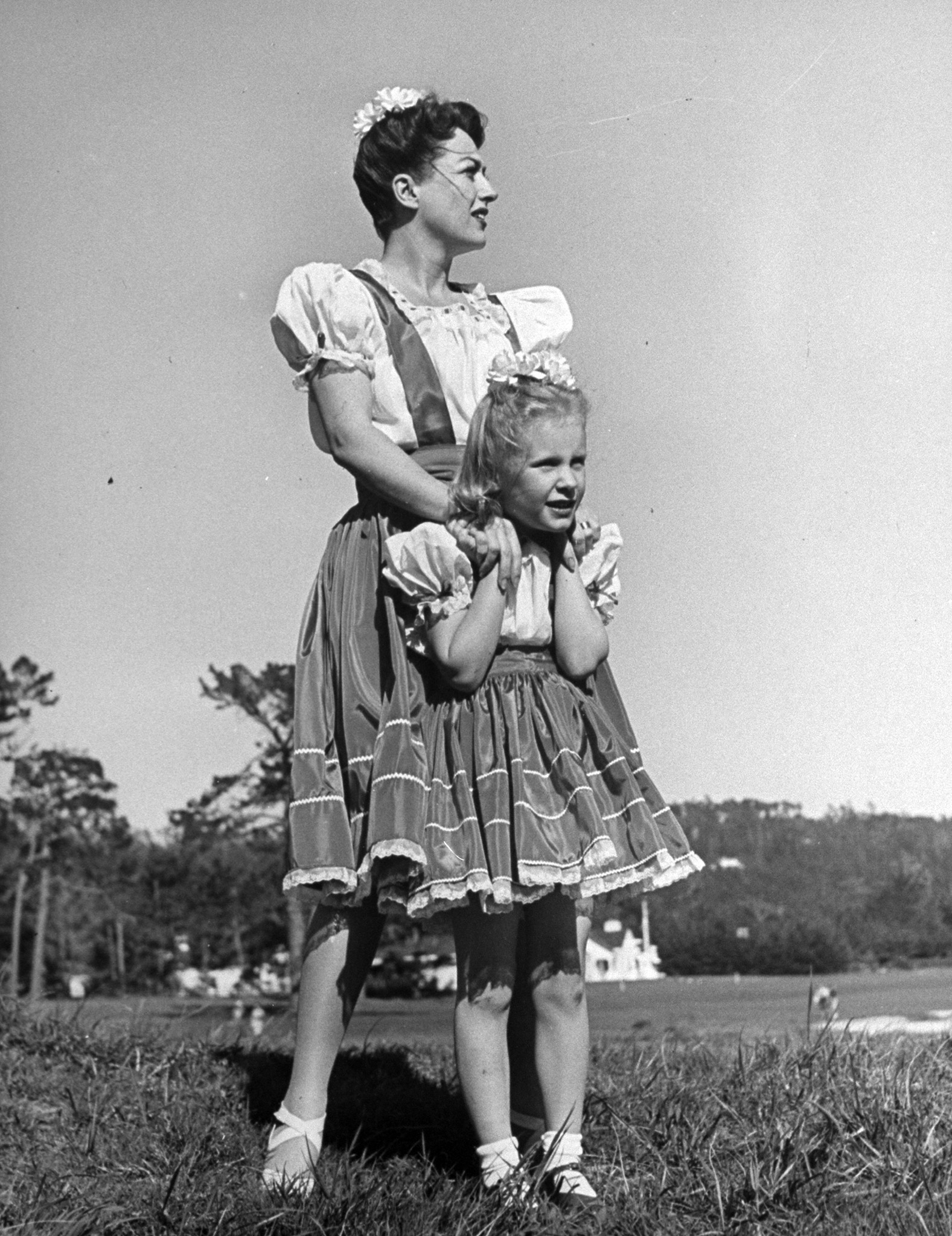 Joan Crawford hugging her adopted daughter, while wearing identical outfits. 1945.