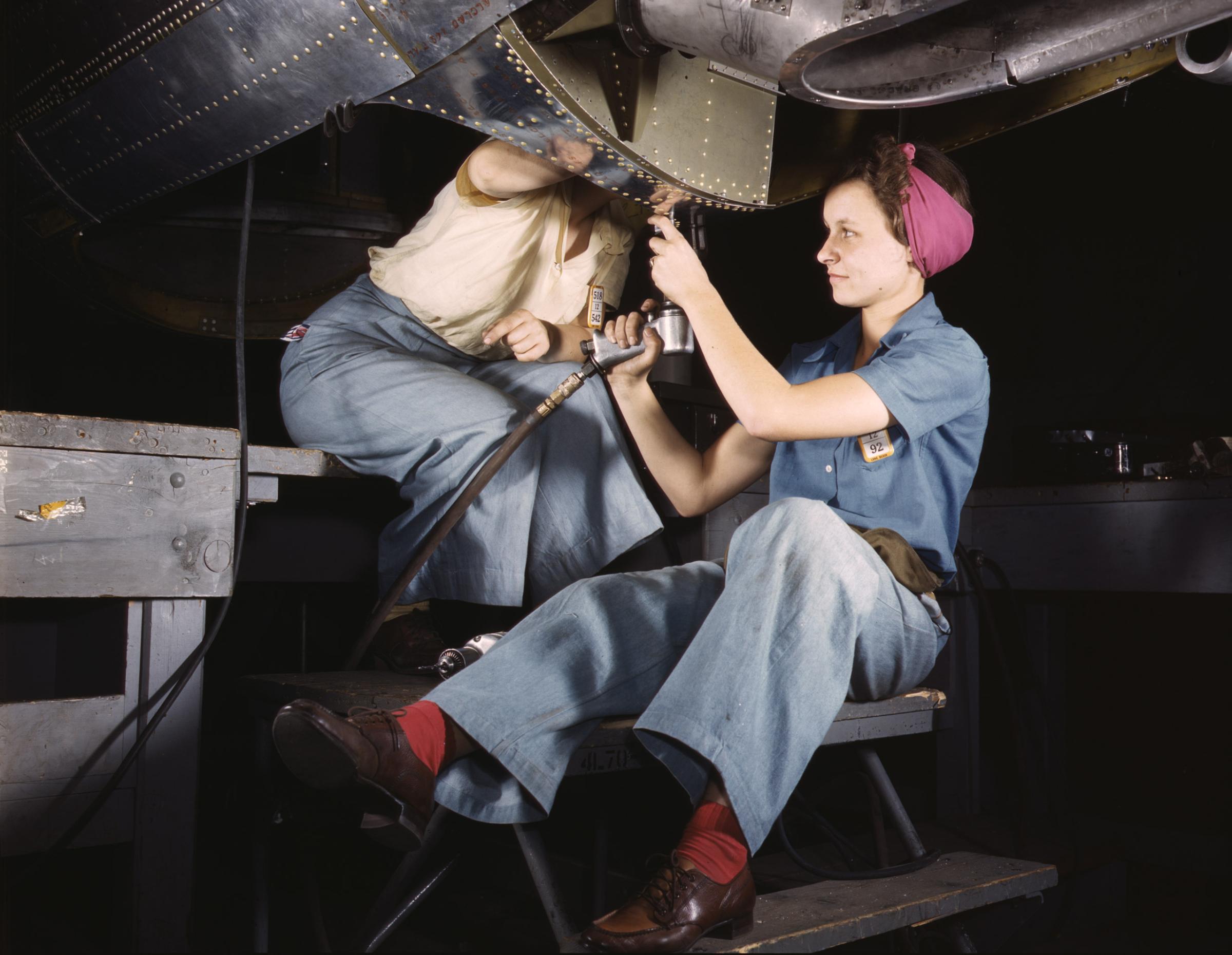 Women at work on C-47 Douglas cargo transport, Douglas Aircraft Company, Long Beach, California, October 1942. Photographed by Alfred T. Palmer for the Farm Security Administration.