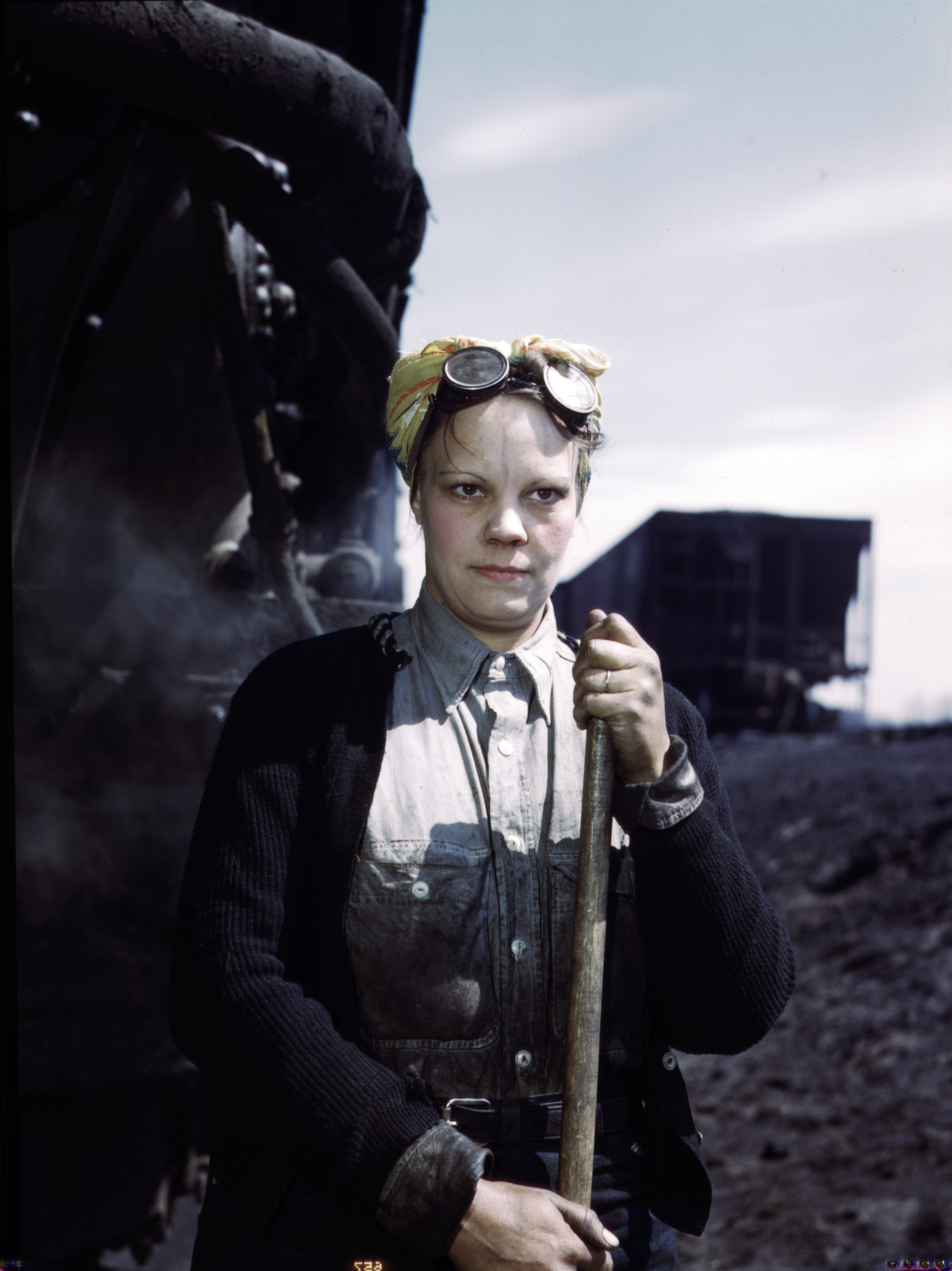 Chicago and North Western Railway Company, Mrs. Irene Bracker, mother of two children, employed at the roundhouse as a wiper, Clinton, Iowa. April 1943. Photographed by Jack Delano for the Farm Security Administration.