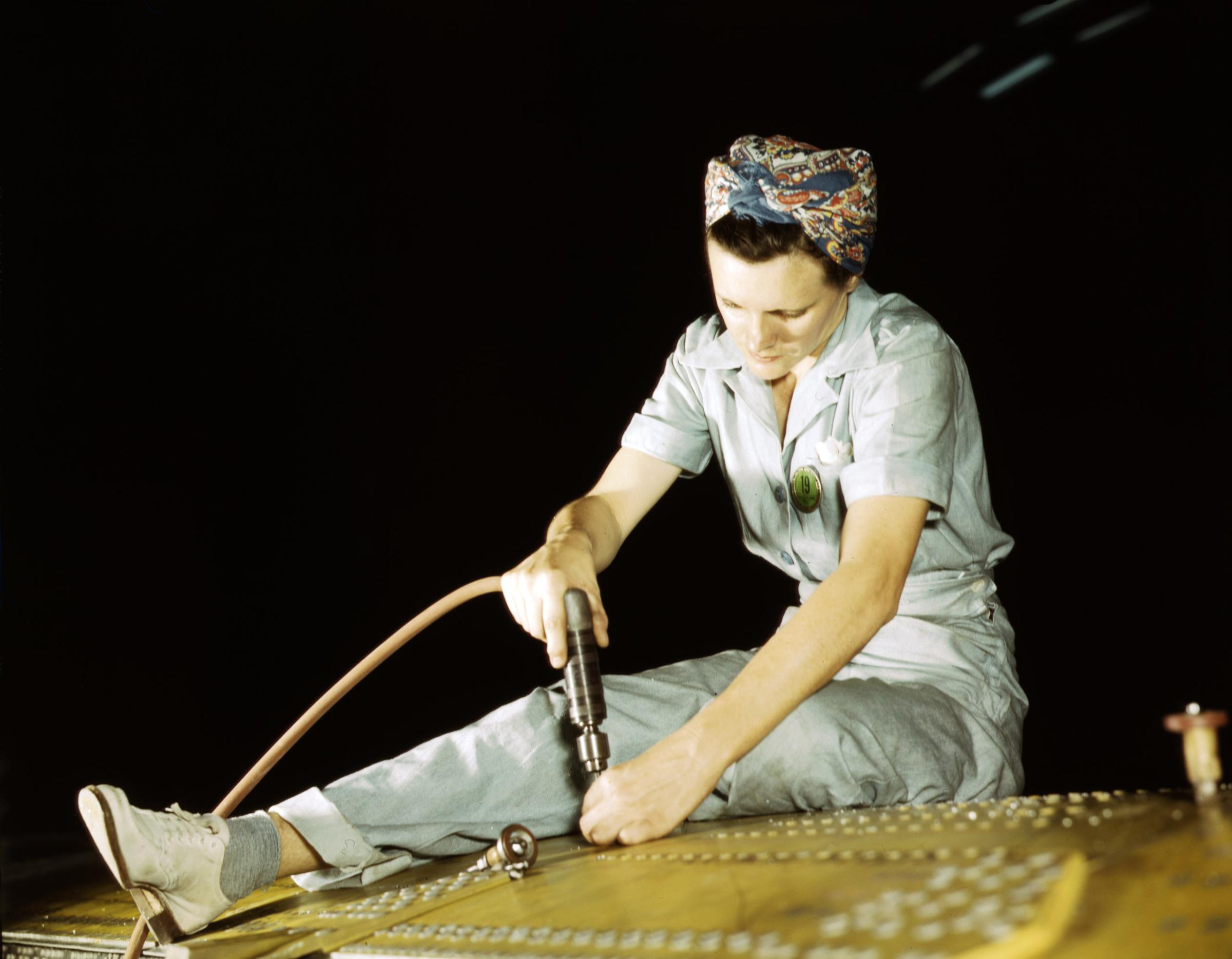 Drilling on a Liberator Bomber, Consolidated Aircraft Corp., Fort Worth, Texas, October 1942. Photographed by Howard R. Hollem for the Farm Security Administration.