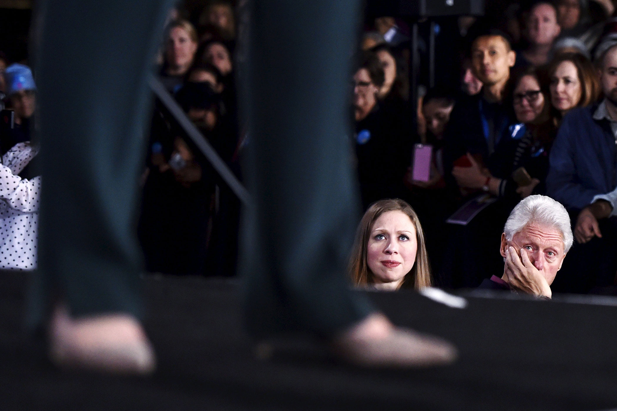 Chelsea Clinton and her father, former President Bill Clinton watch Hillary Clinton speak at a campaign rally at the Clark County Government Center in Las Vegas on Feb. 19, 2016.