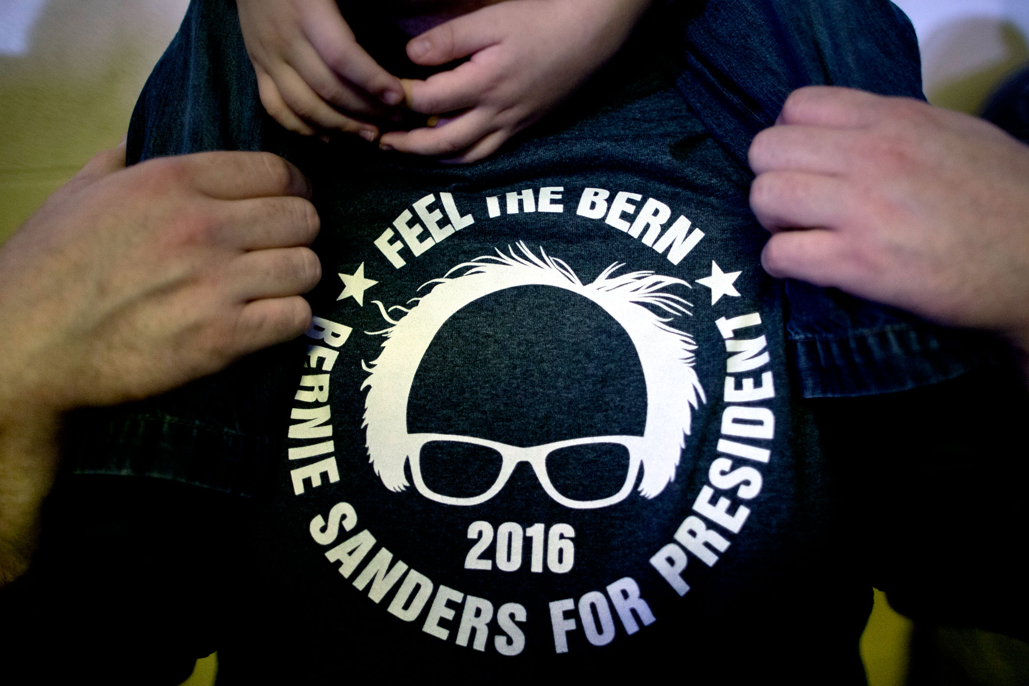 A man wears a shirt supporting Sen. Bernie Sanders, I-Vt., at a campaign event on Jan. in Clinton, Iowa.