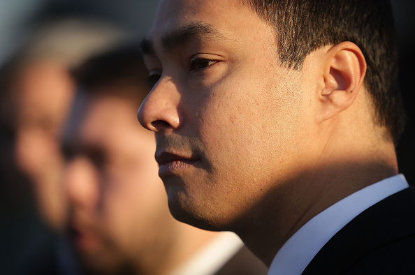 U.S. Rep. Joaquin Castro (D-TX) listens during a news conference in front of the Supreme Court in Washington, D.C., on Dec. 8, 2015.
