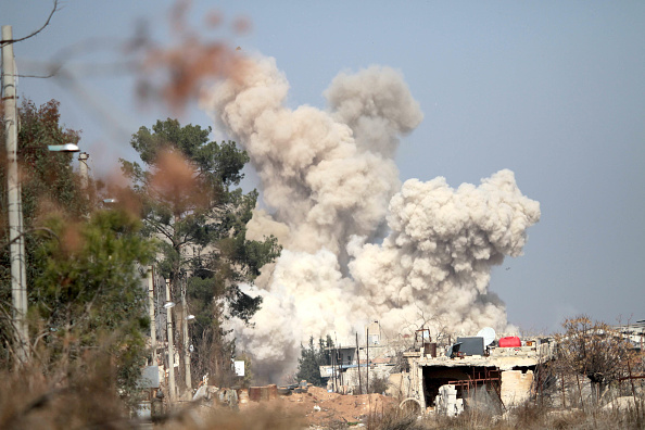 Smoke rises following an air strike targeting rebels in Daraya, southwest of the Syrian capital Damascus, on Feb. 24, 2016 (Yang Zhen—Xinhua News Agency/Getty Images)