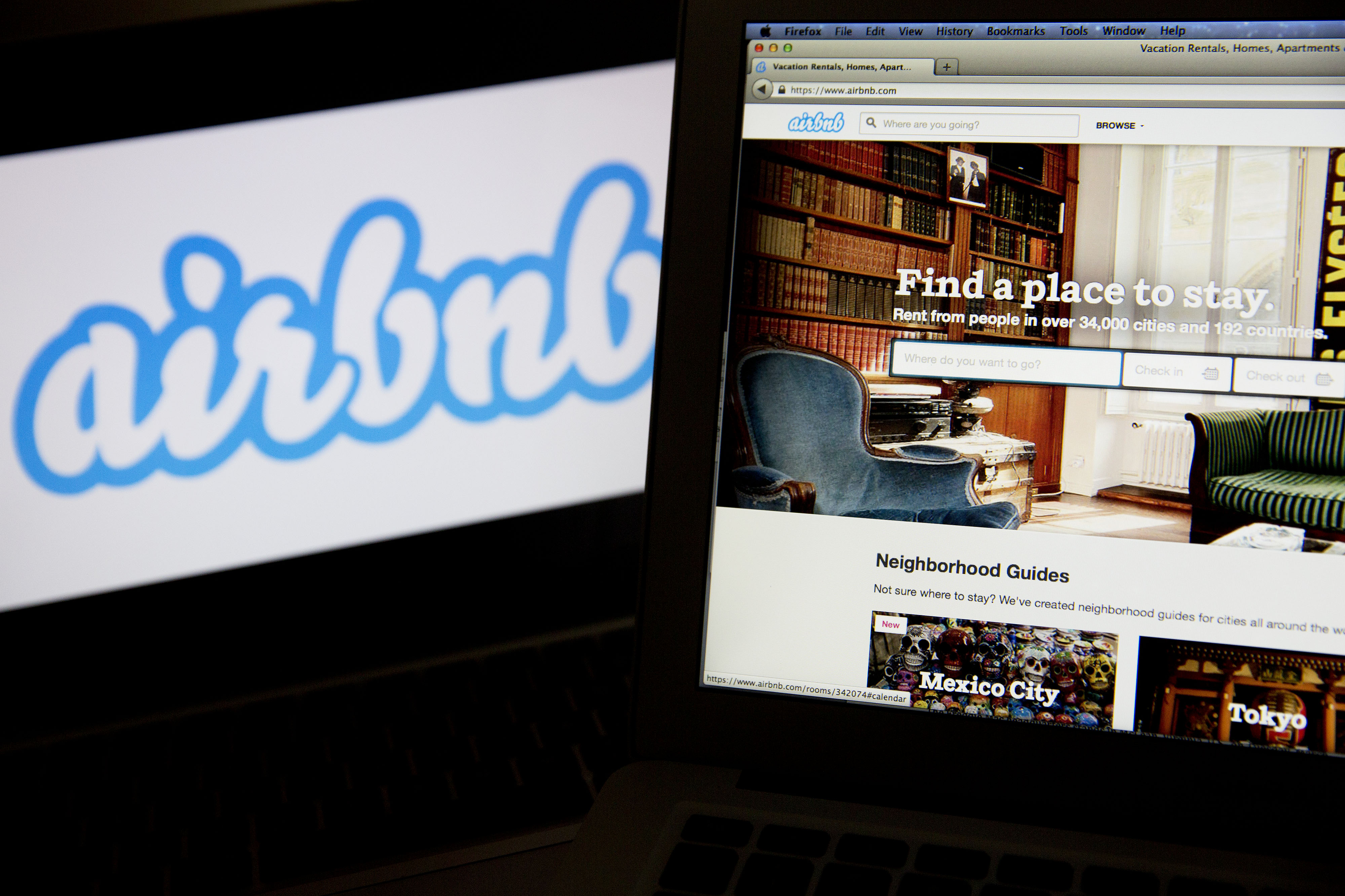 The Airbnb Inc. logo and website are displayed on laptop computers in this arranged photograph in Washington, D.C., U.S., on Friday, March 21, 2014. (Andrew Harrer—Bloomberg/Getty Images)