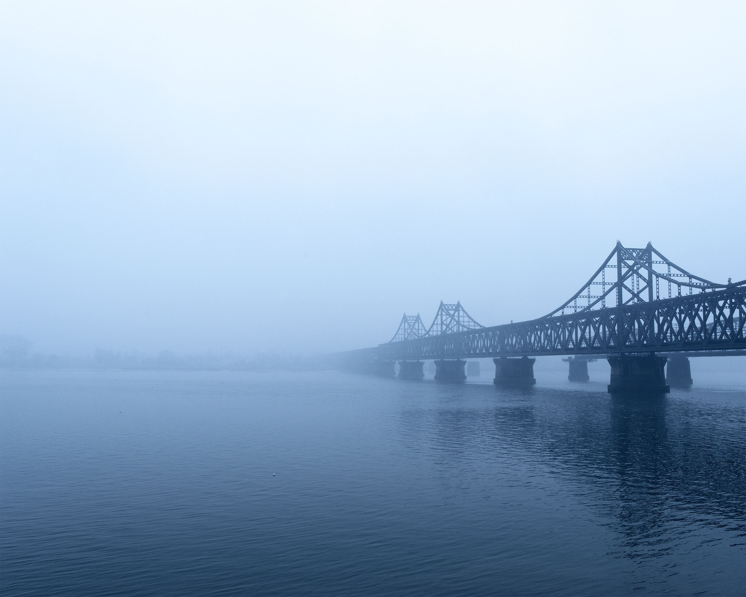 The Sino-Korean
                              Friendship Bridge
                              spans the Yalu River,
                              connecting the cities of
                              Dandong, China, and
                              Sinuiju, North Korea.