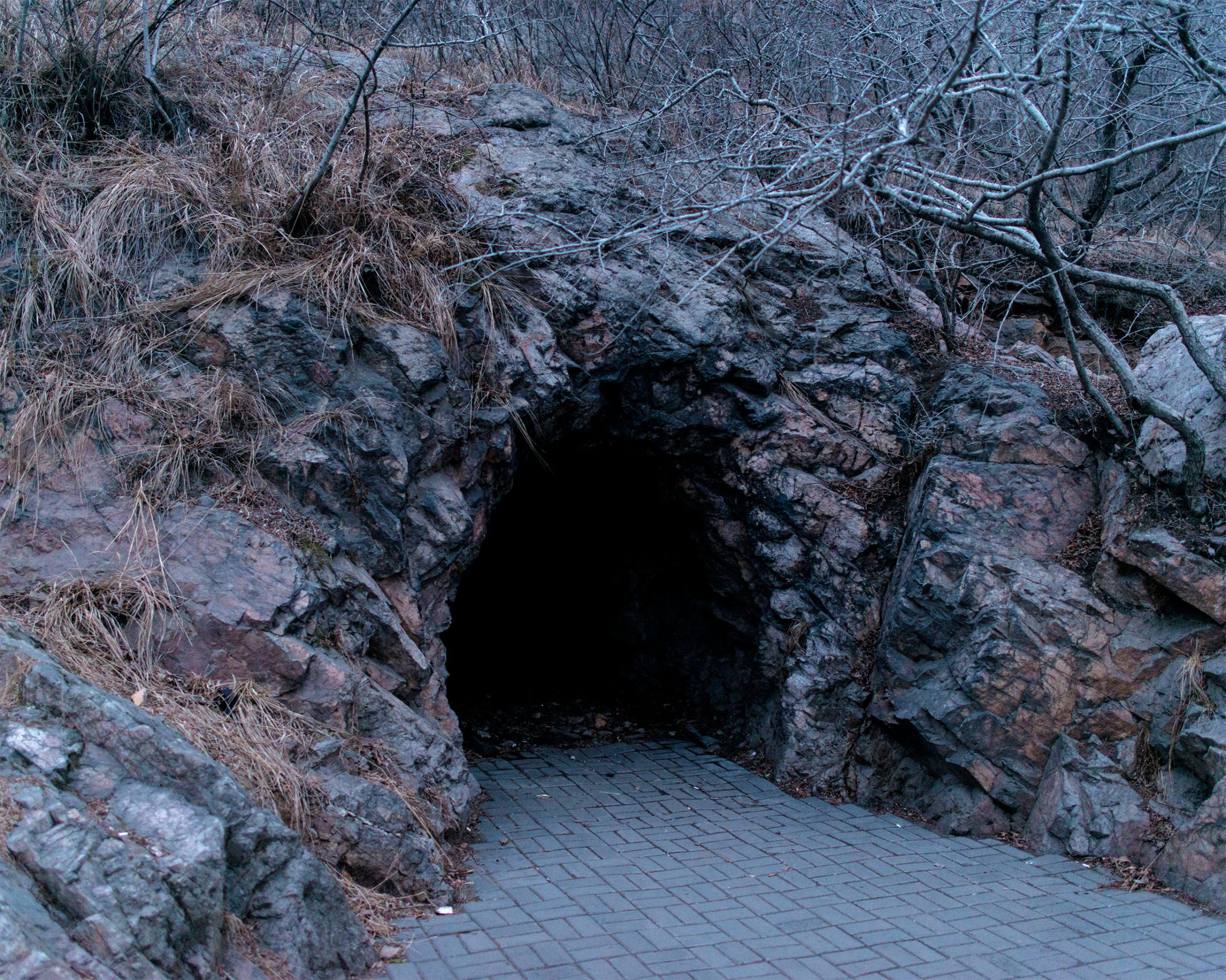 A cave near the Yalu River in the expanding city of Dandong. Caves are used by defectors fleeing from North Korea to hide.
