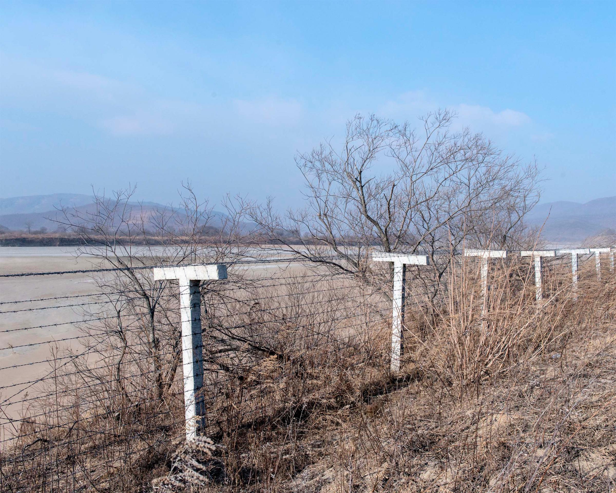A border fence near Hunchun, China that separates China and North Korea.