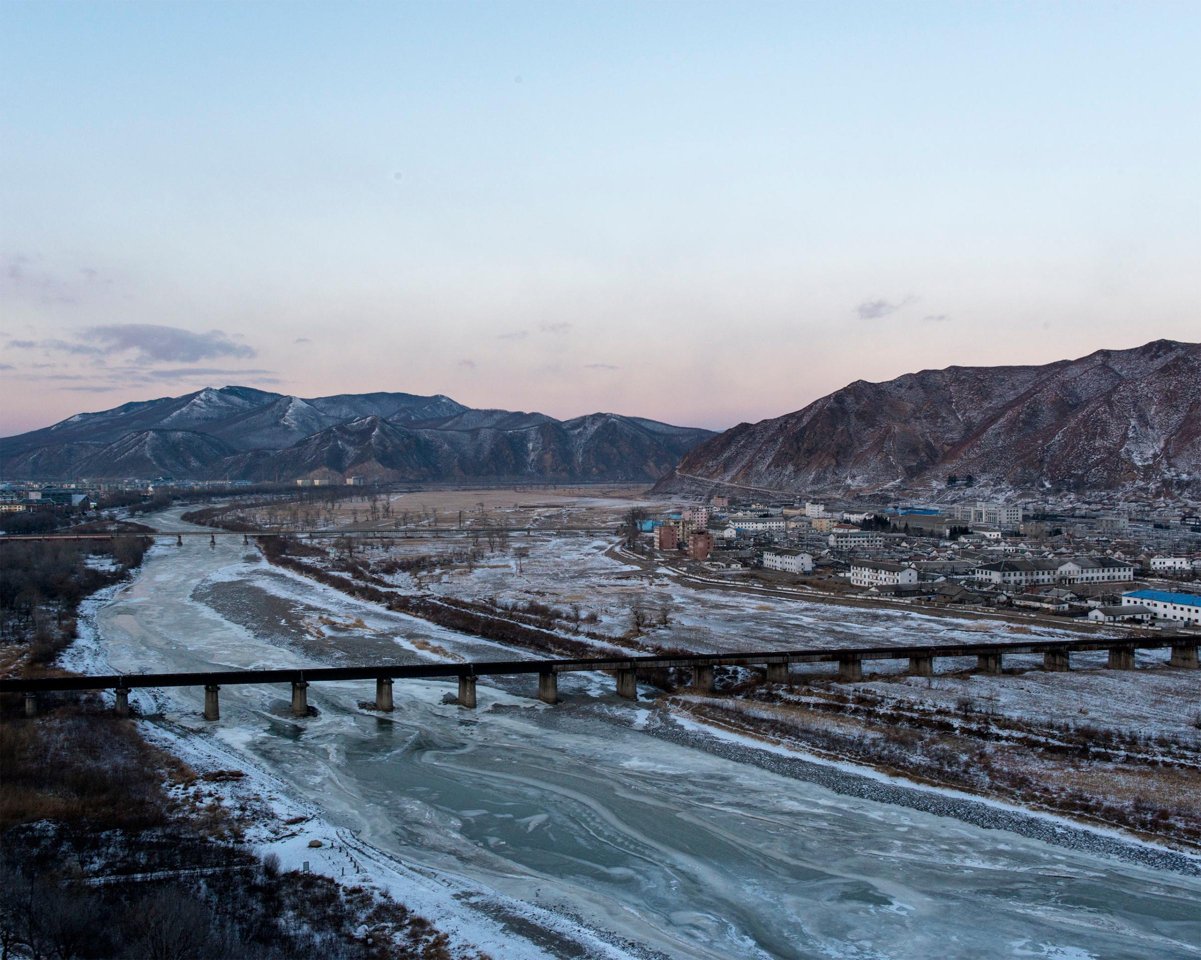 A view of the Tumen river which separates Tumen, China from Namyang, Onsong county, North Korea, at left. Tumen has a very large population of ethnic Koreans, and a detention center for captured North Koreans awaiting deportation.