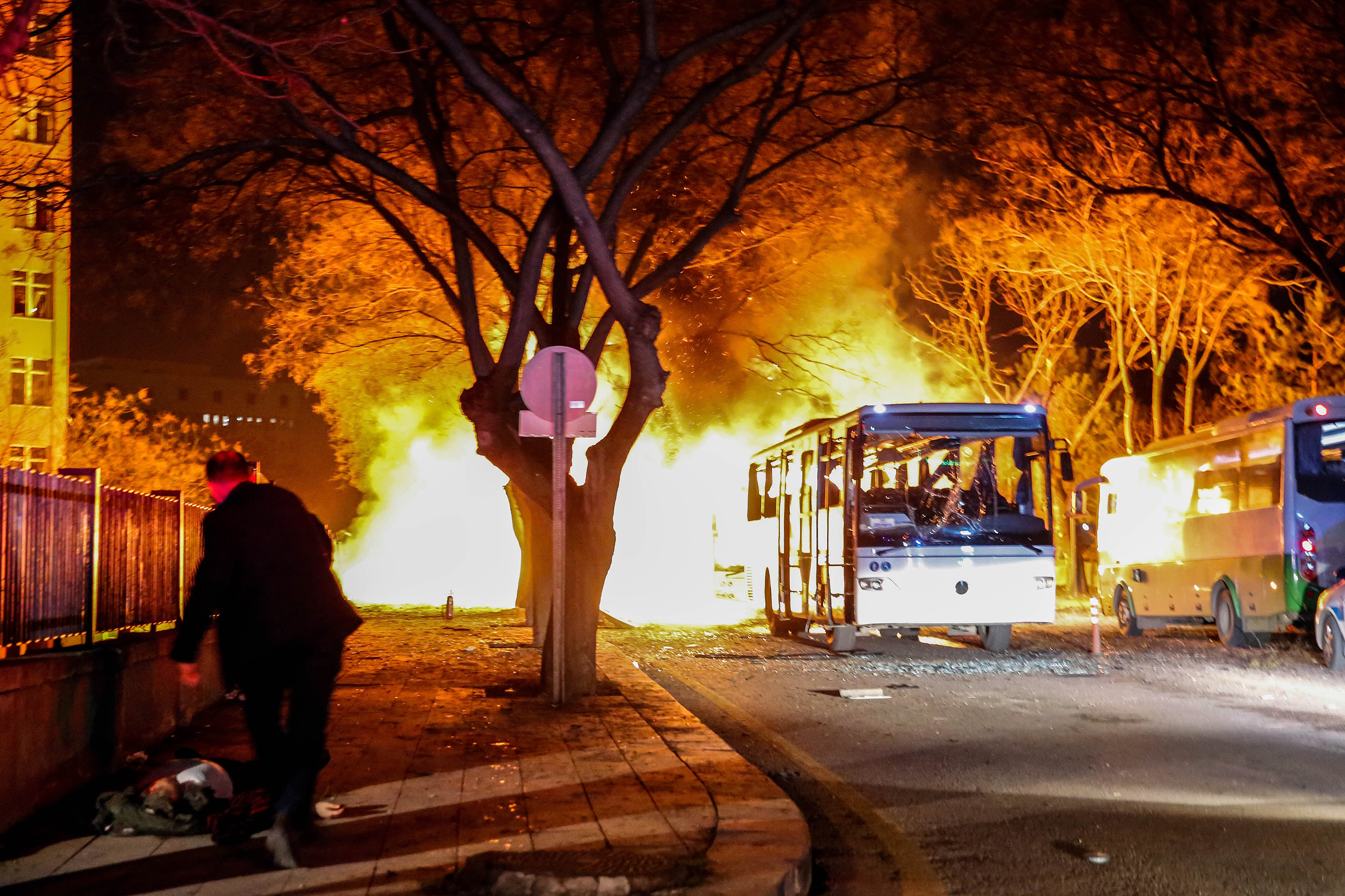 Army service buses burn after an explosion in Ankara, Turkey, Feb. 17, 2016. (Defne Karadeniz—Getty Images)