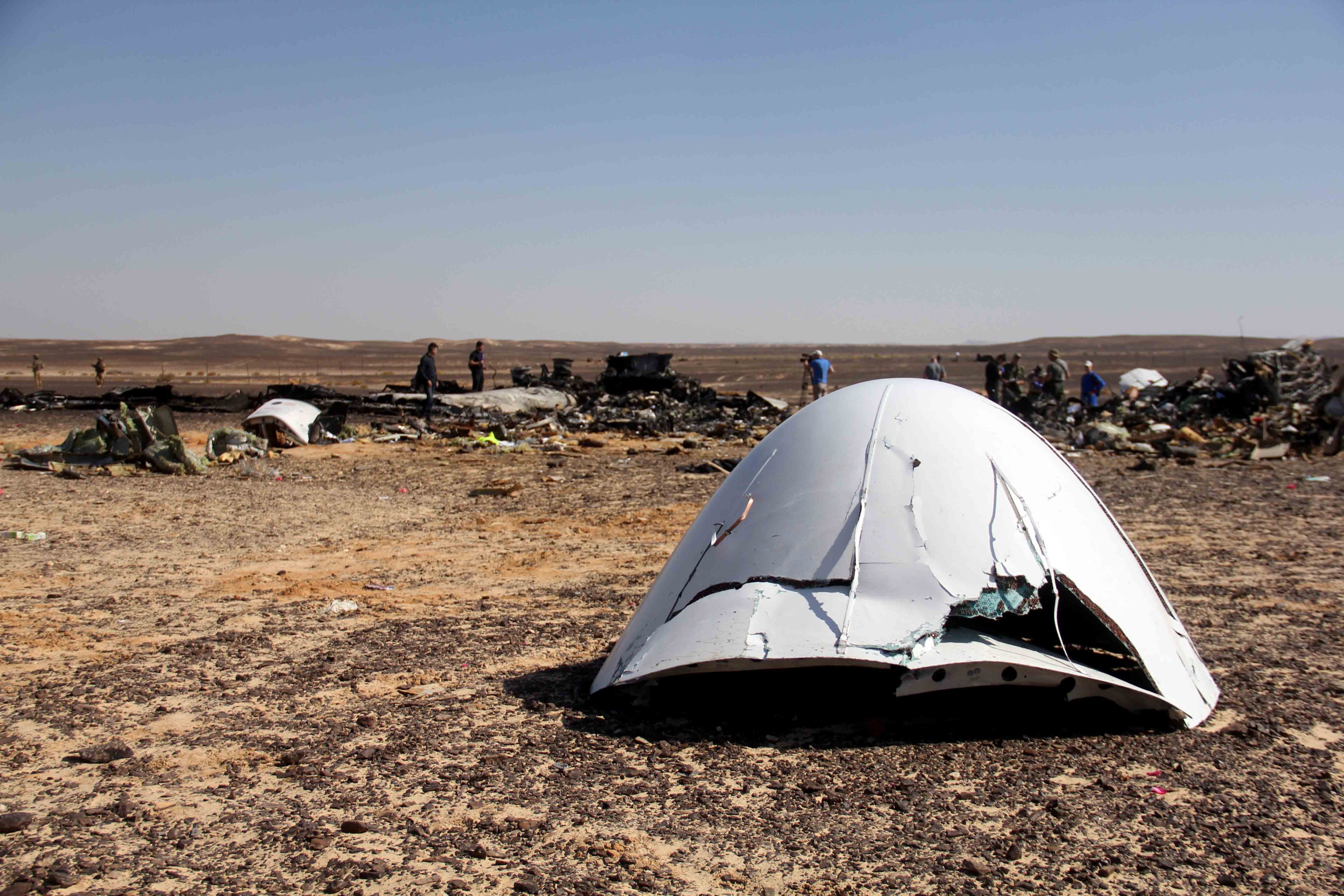 Debris of a Russian airplane is seen at the site a day after the passenger jet bound for St. Petersburg, Russia, crashed in Hassana, Egypt. (AP—AP)