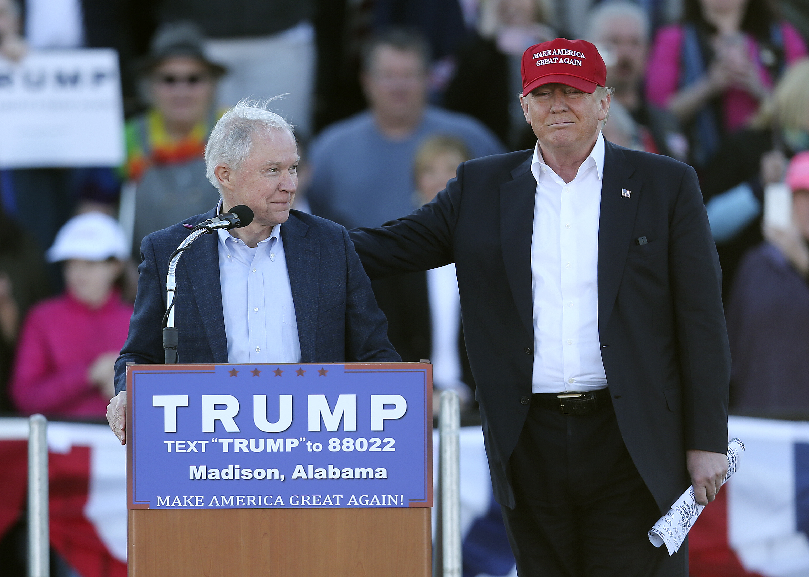 Republican presidential candidate Donald Trump, right, stands next to Sen. Jeff Sessions, R-Ala., as Sessions speaks  during a rally Sunday, Feb. 28, 2016, in Madison, Ala. (John Bazemore—AP)