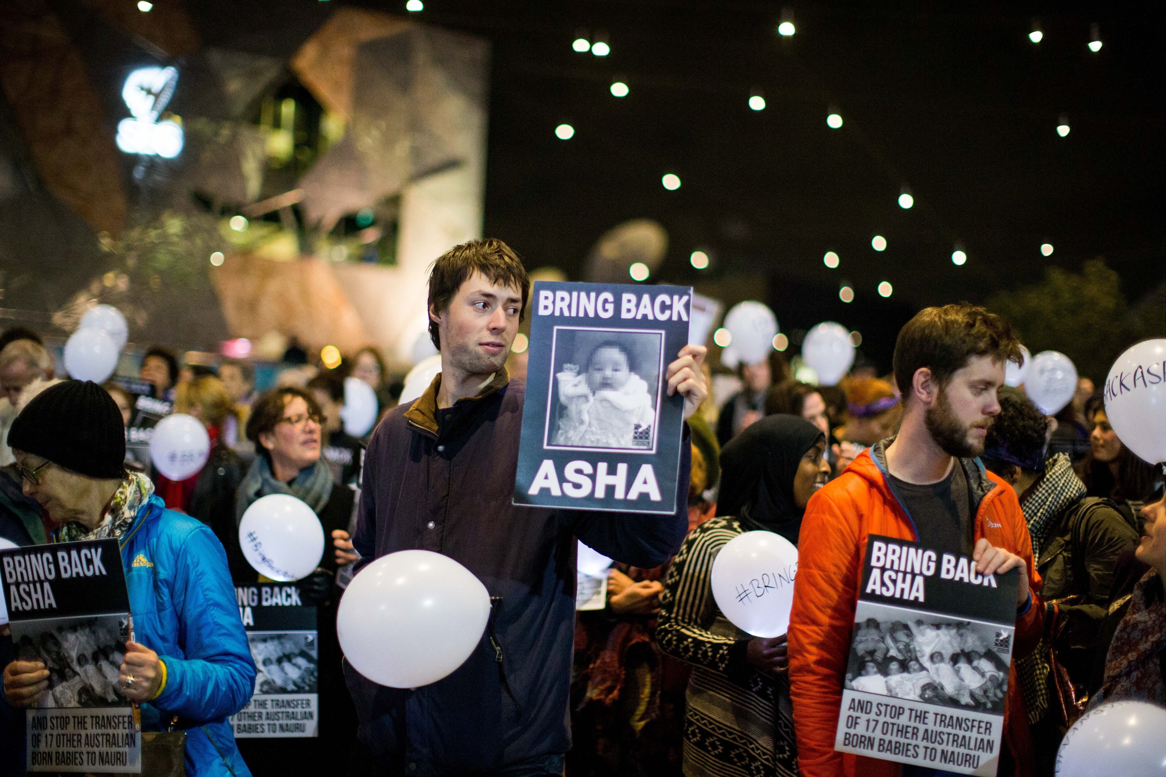 Protestors at a rally at Melbourne's Federation Square to protest the deportation of 5 month old refugee 'Asha' to Nauru, in Melbourne, Australia on June 25, 2015. (Asanka Brendon Ratnayake—Anadolu Agency/Getty Images)