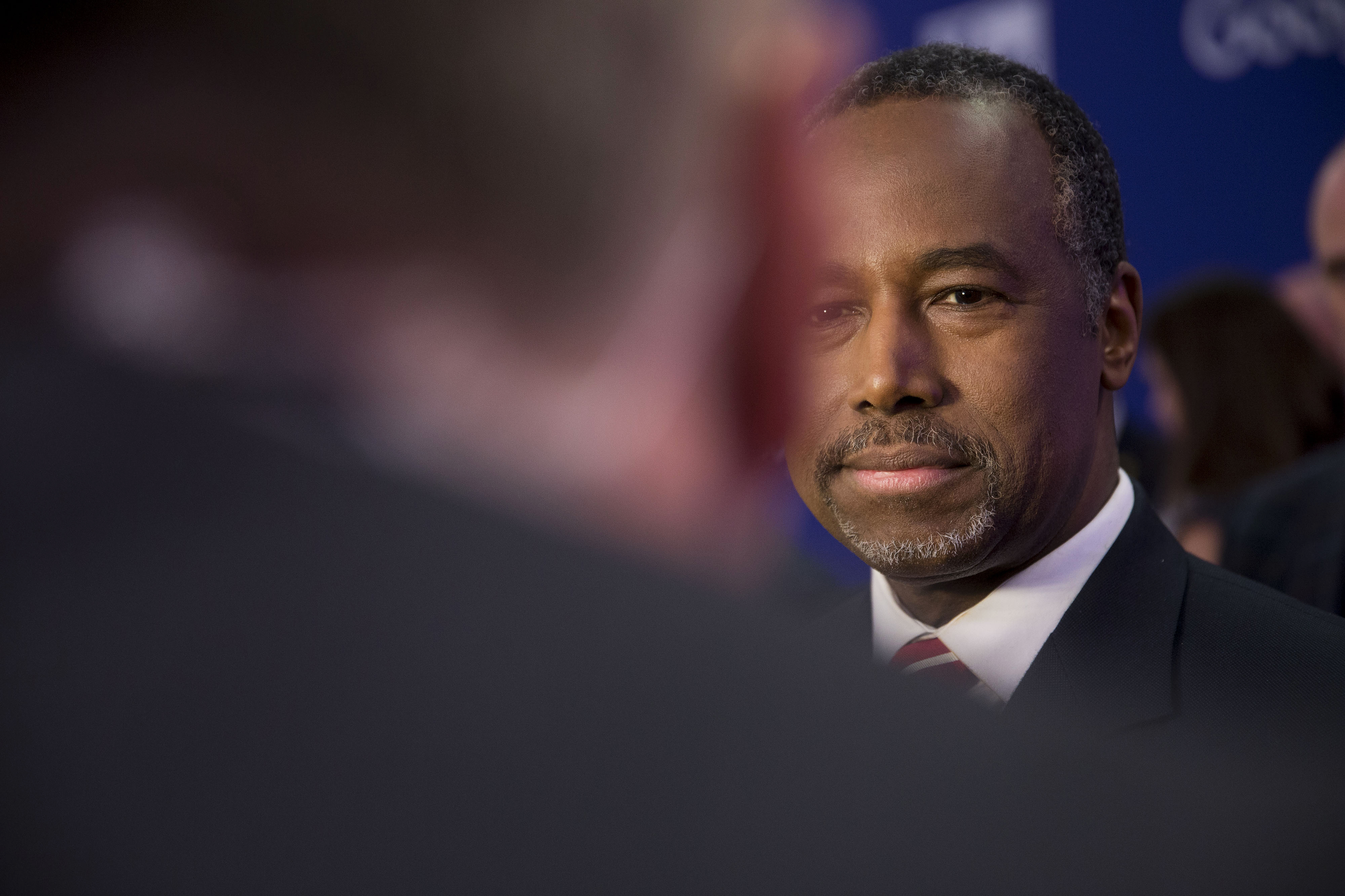 Ben Carson talks to a member of the media in the spin room following the Republican presidential candidate debate in Des Moines, Iowa on Jan. 28, 2016. (Daniel Acker—Bloomberg/Getty Images)