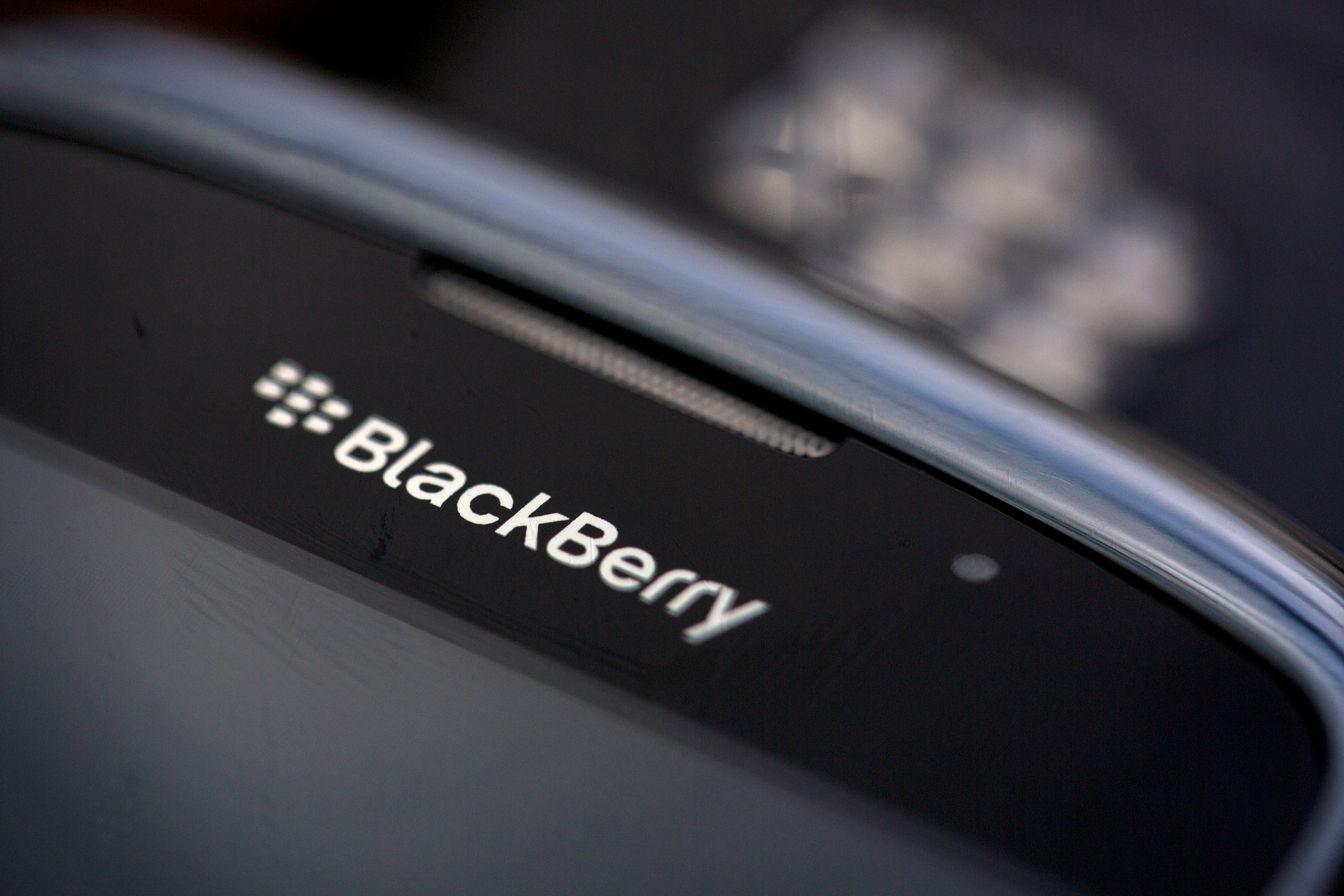 The BlackBerry logo is seen on the screen of a BlackBerry Curve smartphone, produced by BlackBerry Ltd., in this arranged photograph taken in London, U.K., on Monday, Sept. 23, 2013.