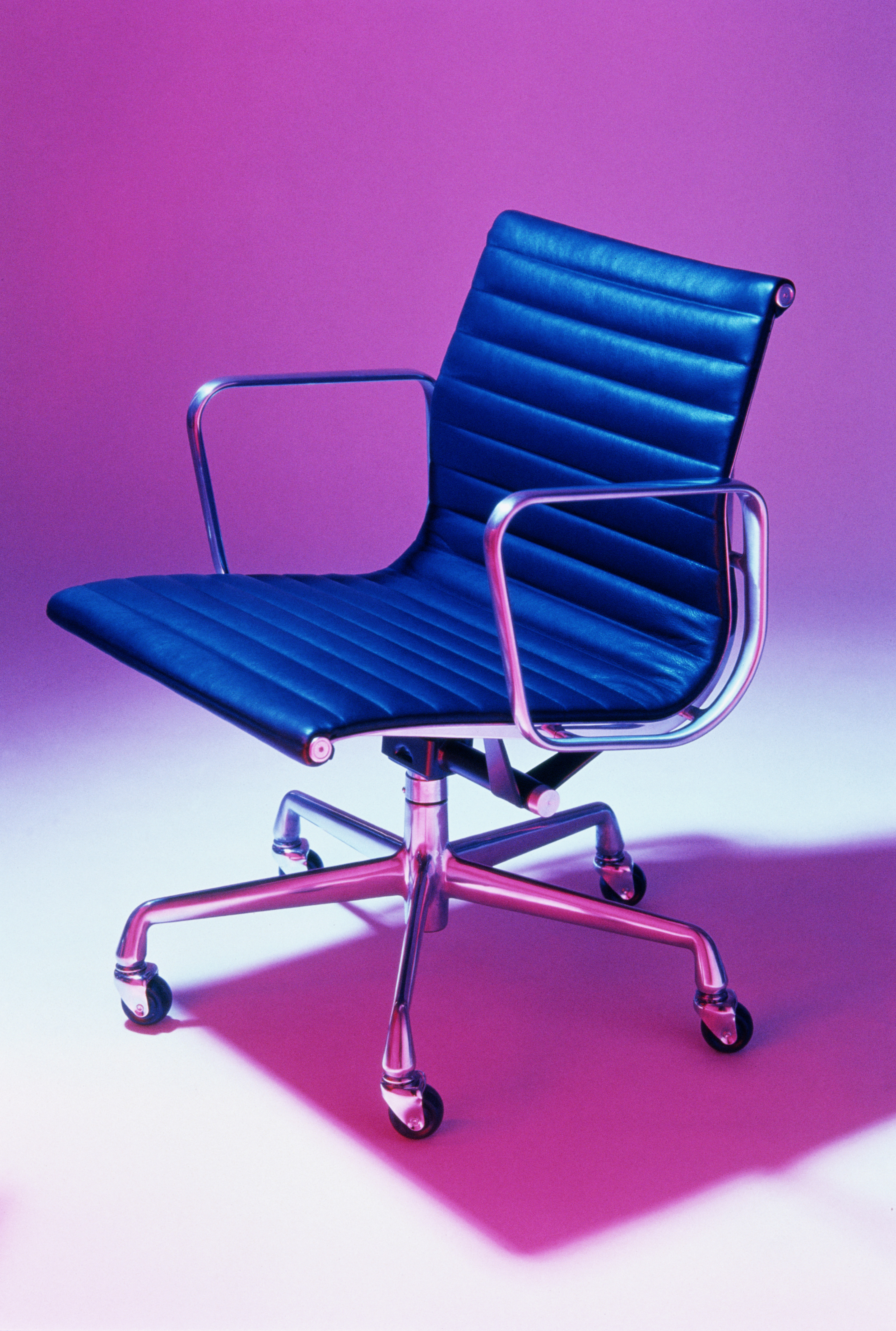 blue-office-chair-pink-background