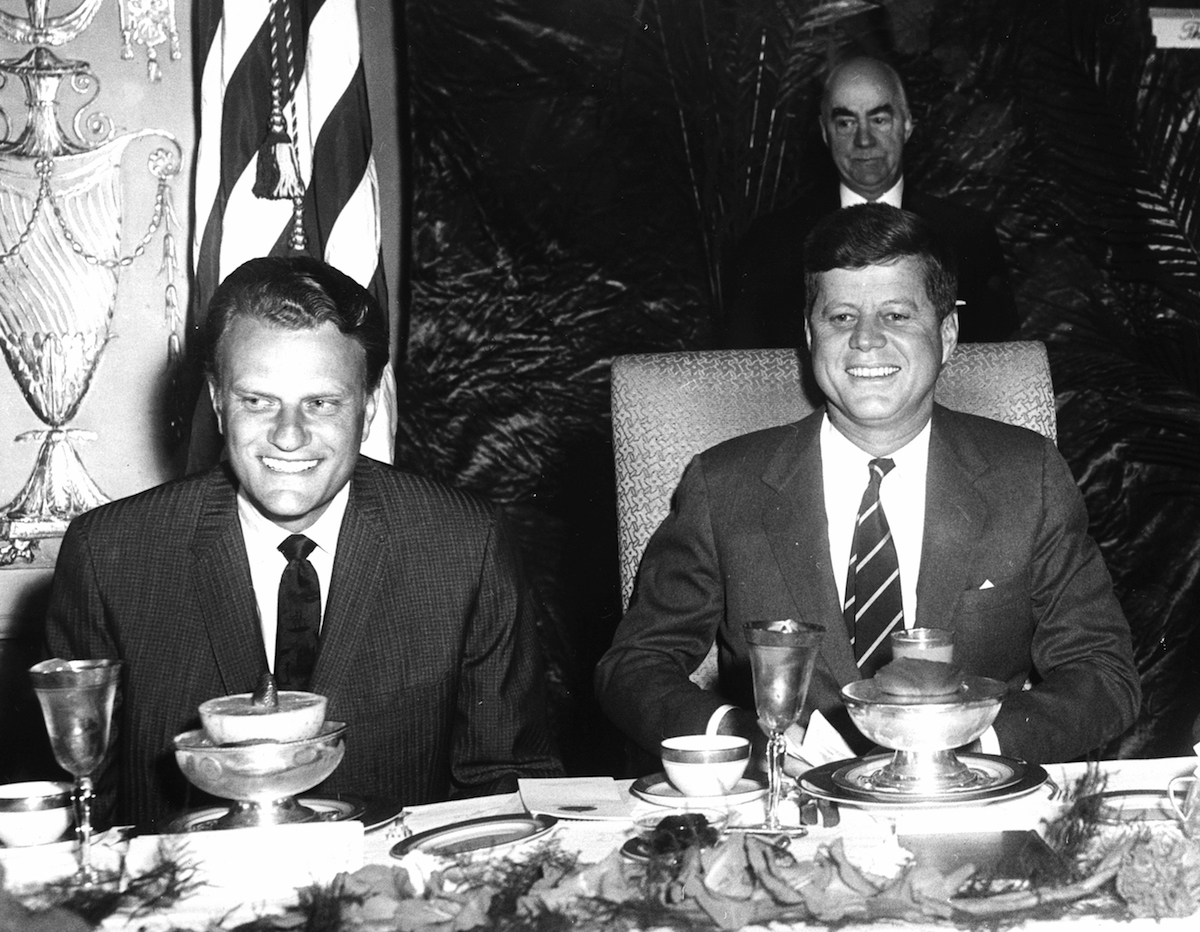 Rev. Billy Graham and President John F. Kennedy at a National Prayer Breakfast, Feb. 9, 1961. (PhotoQuest / Getty Images)