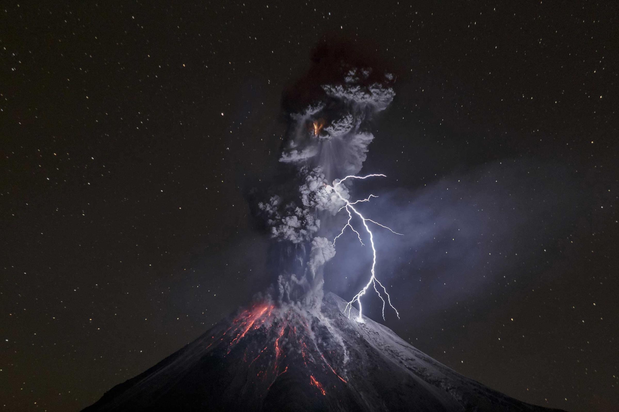 Nature, 3rd prize singles. Colima Volcano in Mexico shows a powerful night explosion with lightning, ballistic projectiles and incandescent rockfalls; image taken in the Comala municipality in Colima, Mexico, Dec. 13, 2015.