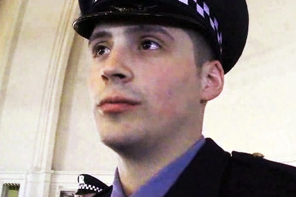 Officer Robert Rialmo states what becoming an officer means to him during a interview with a Chicago Tribune reporter at the Chicago Police Academy graduation ceremony on March 26, 2013.