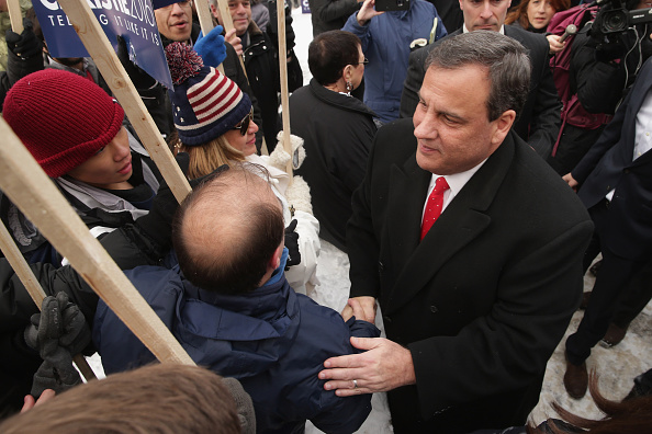 Republican presidential candidate New Jersey Governor Chris Christie (R) greets supporters outside the polling place at Webster School February 9, 2016 in Manchester, New Hampshire.