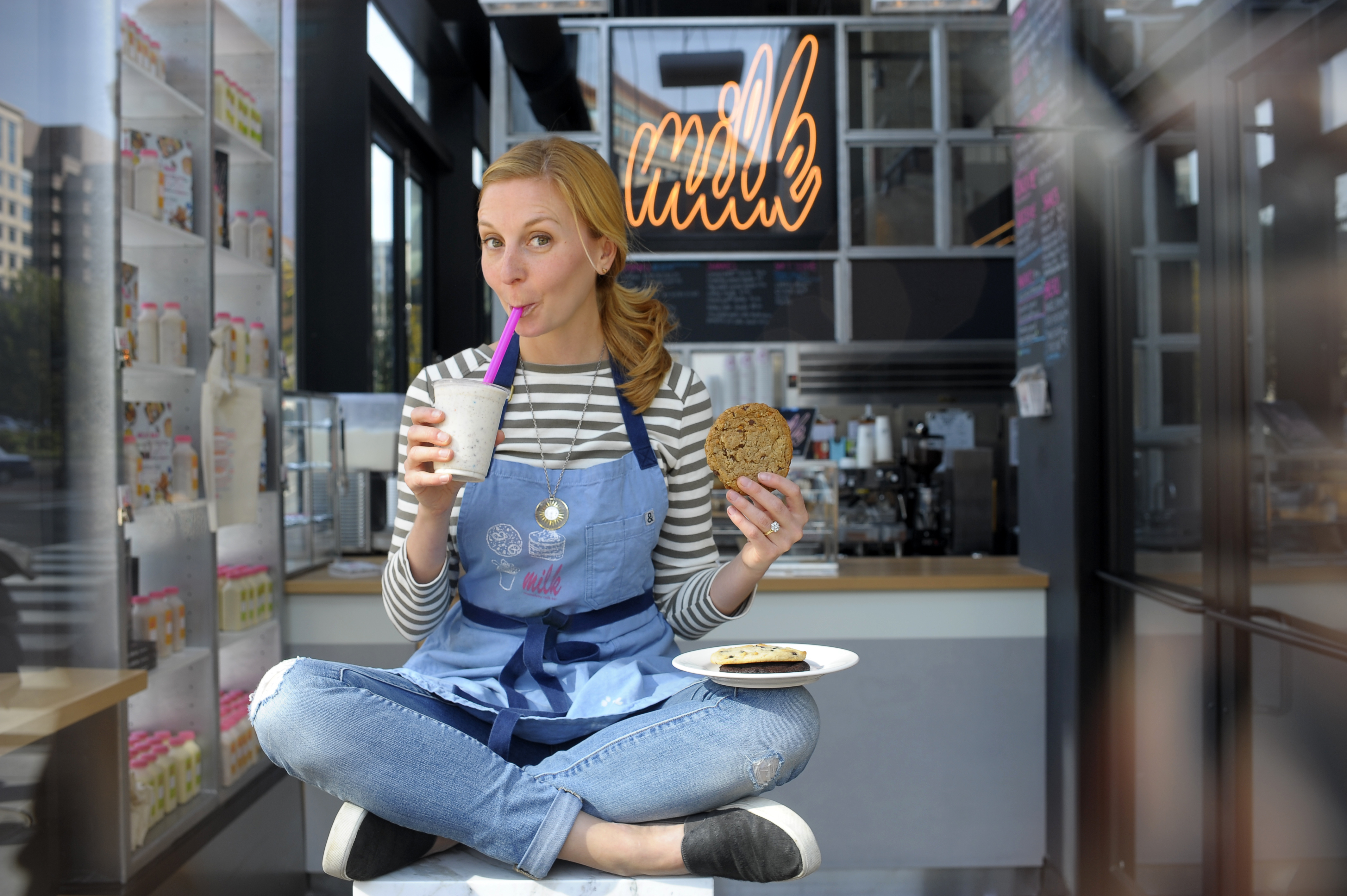 Christina Tosi, with a birthday cake shake and signature cookie, poses inside a Milk in Washington, DC. Bar Oct. 22, 2015. (Katherine Frey—The Washington Post/Getty Images)