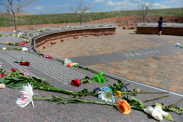 Visitors spend time at the Columbine Memorial on Monday, April 20, 2015.