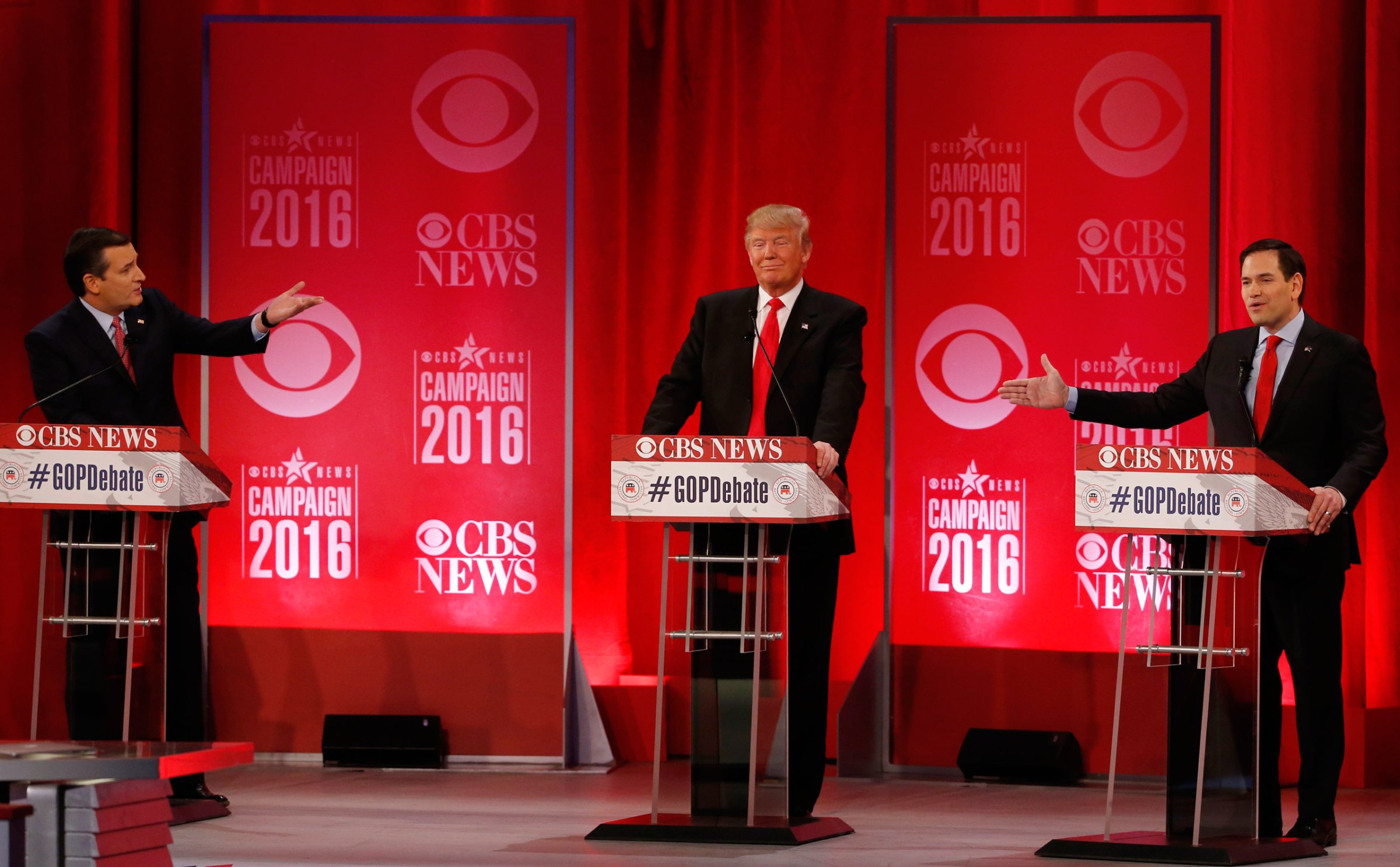 Republican U.S. presidential candidates Senator Ted Cruz (L) and Senator Marco Rubio (R) both gesture at businessman Donald Trump (C) during the Republican U.S. presidential candidates debate sponsored by CBS News and the Republican National Committee in Greenville, South Carolina February 13, 2016. REUTERS/Jonathan Ernst - RTX26TV5
