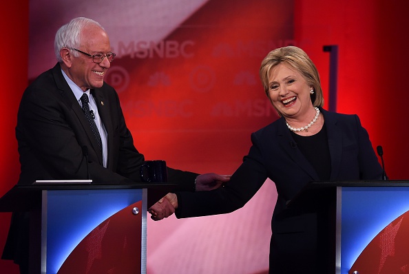 US Democratic presidential candidates Hillary Clinton (R) and Bernie Sanders shake hands as they participate in the MSNBC Democratic Candidates Debate at the University of New Hampshire in Durham on Feb. 4, 2016.