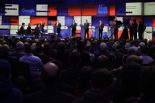 Republican presidential candidates (R-L) Ohio Governor John Kasich, Jeb Bush, Sen. Marco Rubio (R-FL), Sen. Ted Cruz (R-TX), Ben Carson, New Jersey Governor Chris Christie and Sen. Rand Paul (R-KY) wait for the beginning of the Fox News - Google GOP Debate January 28, 2016 at the Iowa Events Center in Des Moines, Iowa.
