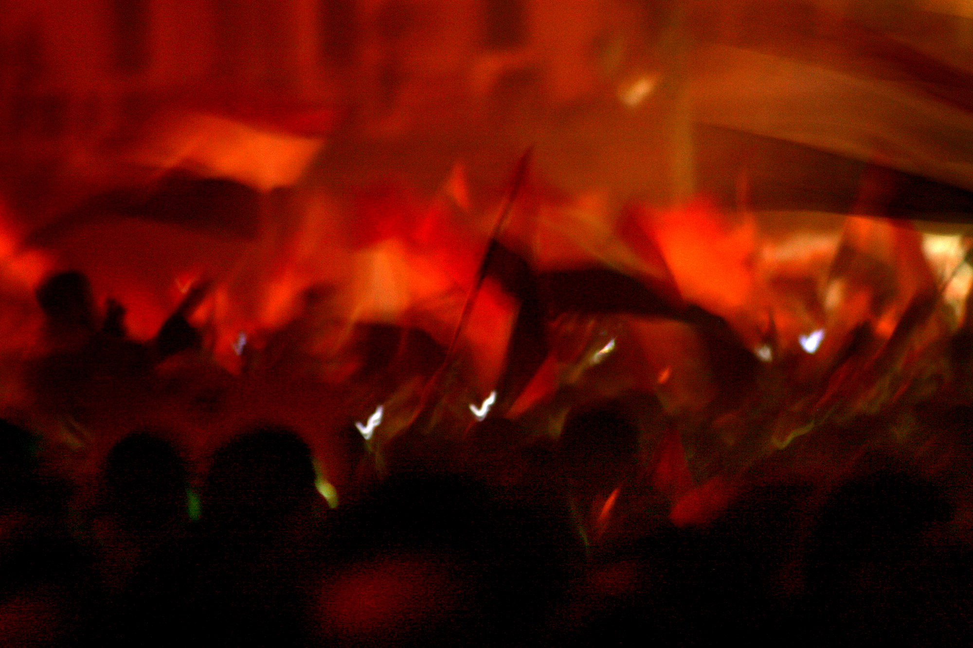 7:17 p.m. Demonstrators wave flags and raise their fists in the air while celebrating the resignation of Egyptian President Hosni Mubarak in Tahrir Square, Cairo, Feb. 11, 2011.
