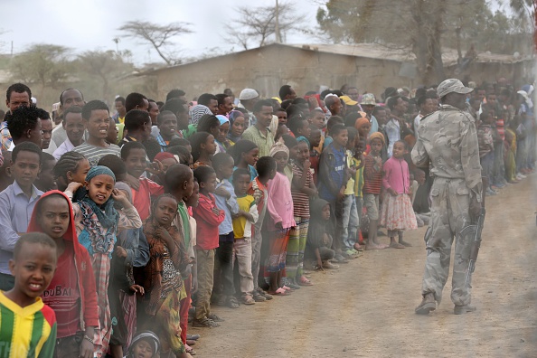 Local residents await the arrival of the UN secretary-general in Ogolcho in Ethiopia's drought affected Oromia region to tour various UN drought relief projects on Jan. 31, 2016.