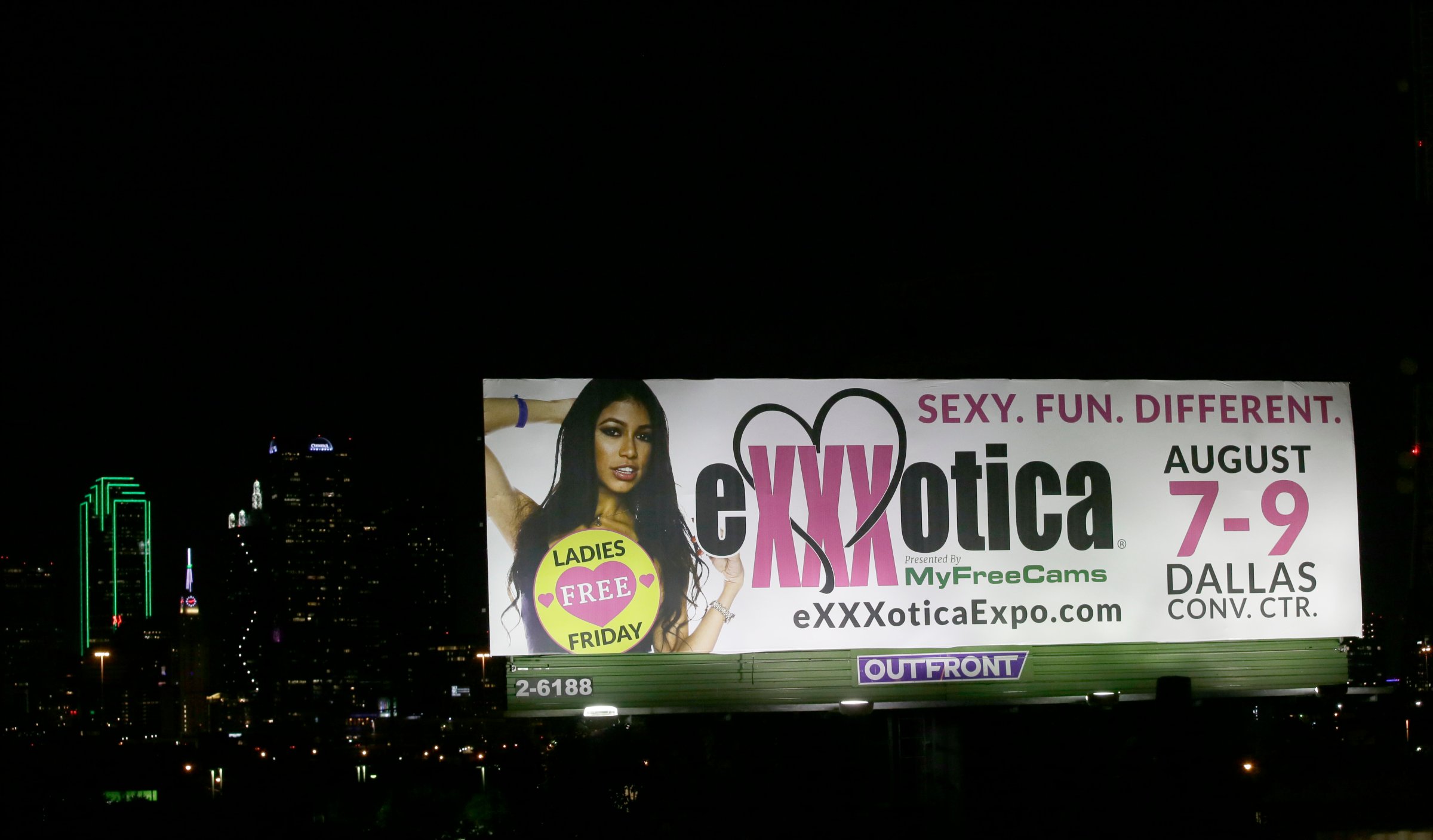 A billboard sign advertises the Exxxotica expo in Dallas, July 31, 2015.