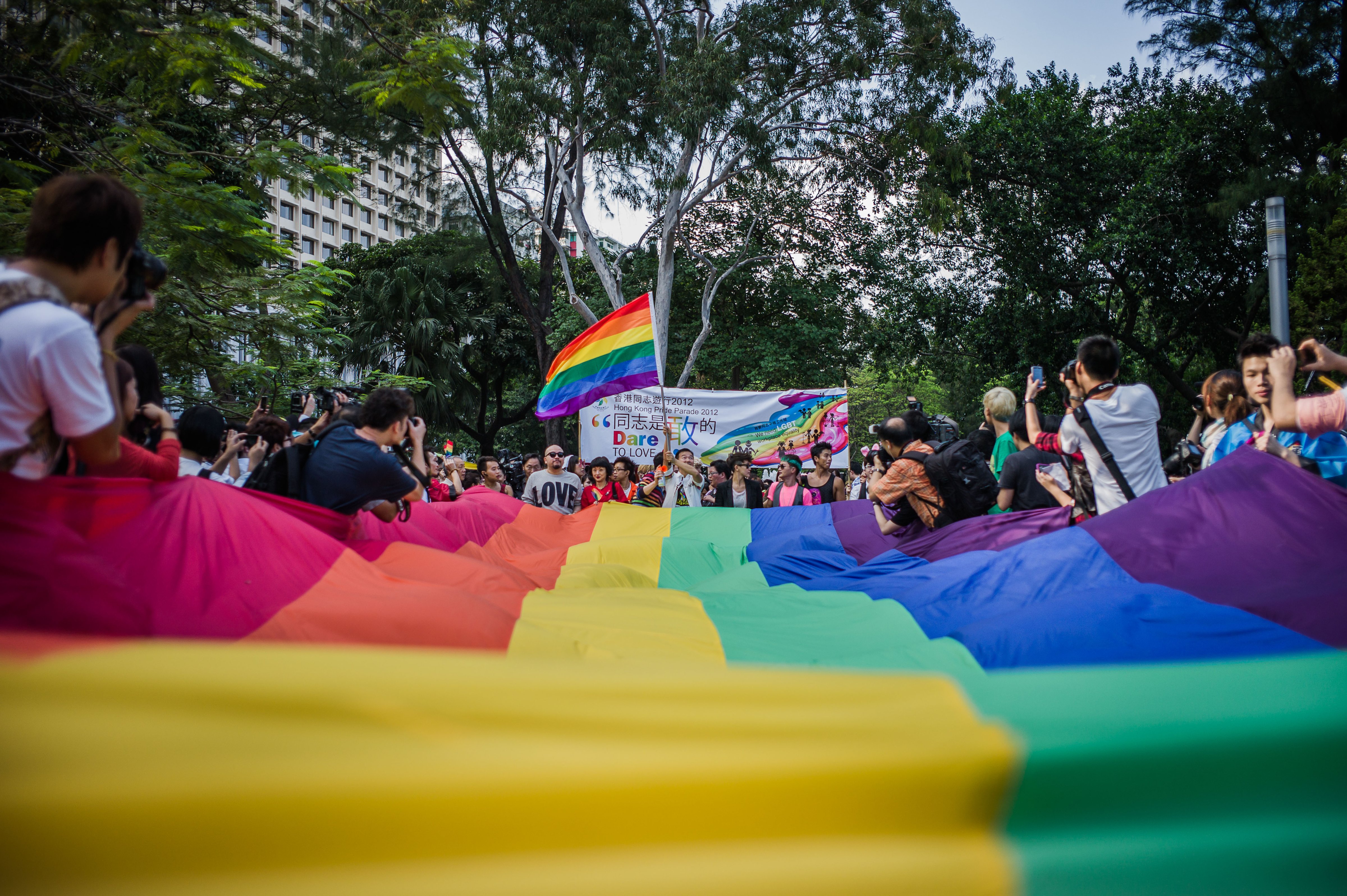 Participants carry a large rainbow flag as they take part in a gay-pride procession on Nov. 10, 2012 (Philippe Lopez—AFP/Getty Images)