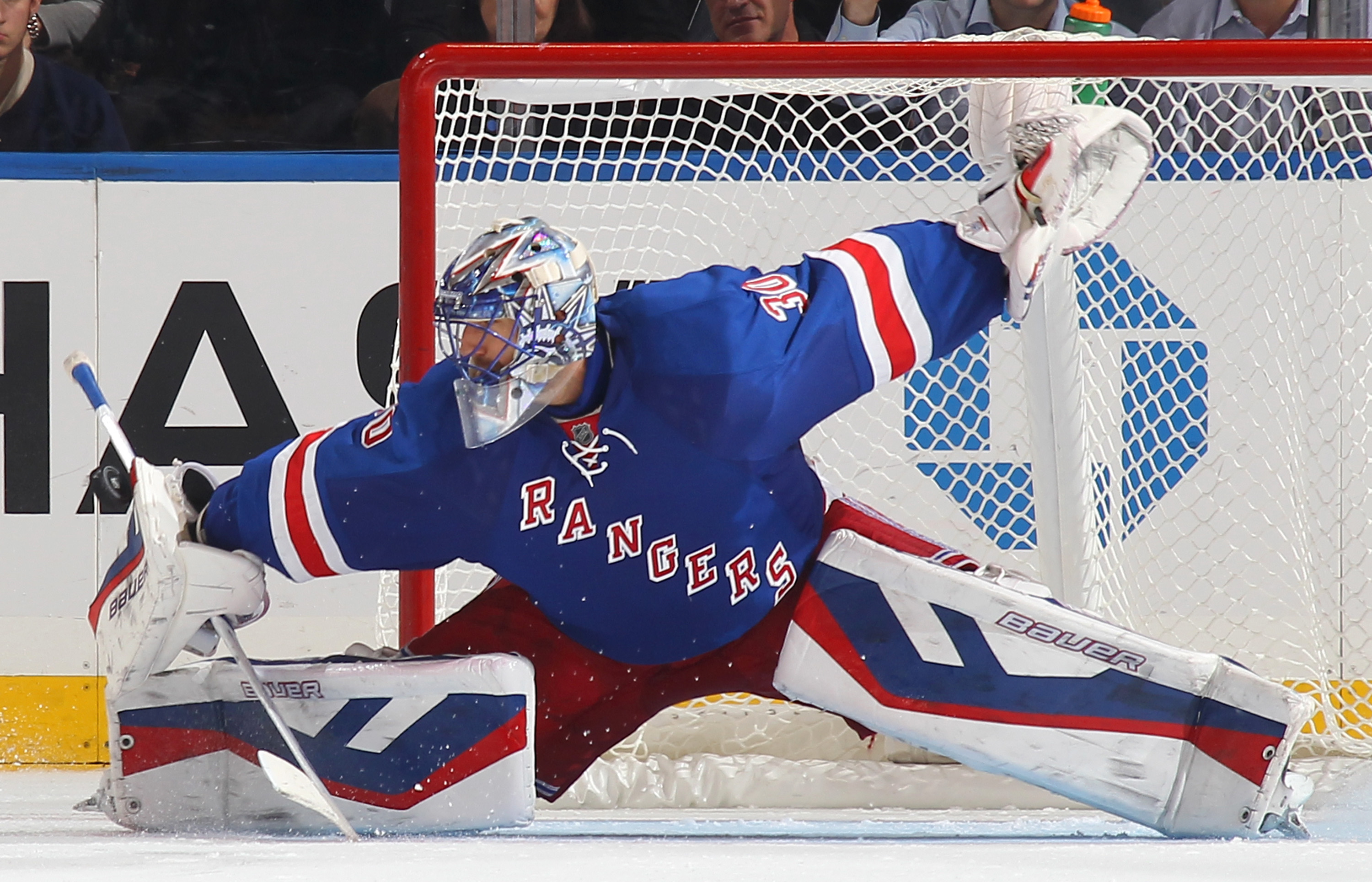 Henrik Lundqvist #30 of the New York Rangers makes a blocker save during the shootout against the Carolina Hurricanes at Madison Square Garden on October 16, 2014 in New York City. (Jared Silber&mdash;NHLI via Getty Images)