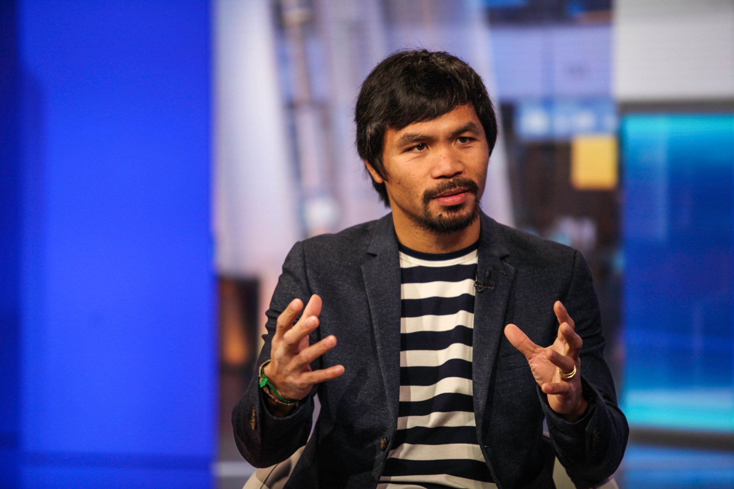 Professional boxer Manny Pacquiao speaks during a Bloomberg Television interview in New York, U.S., on Tuesday, Oct. 13, 2015. Pacquiao discussed his career as a boxer and politician and what motivates him to do charity work. Photographer: Chris Goodney/Bloomberg *** Local Caption *** Manny Pacquiao