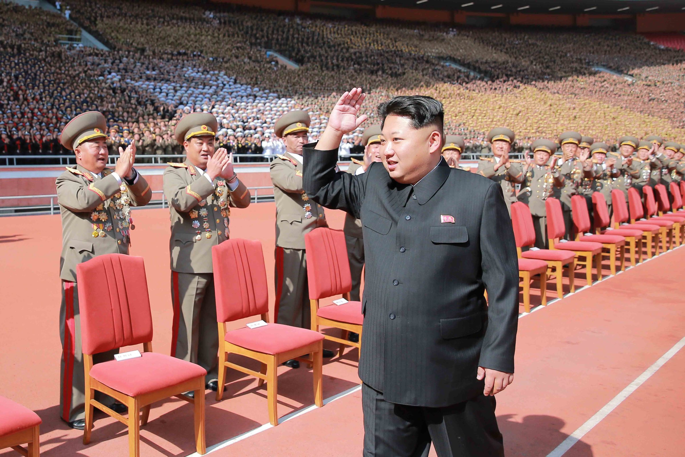 PYONGYANG, Oct. 14, 2015 -- Photo provided by Korean Central News Agency on Oct. 14, 2015 shows top leader of the Democratic People's Republic of Korea Kim Jong Un recently having a photo session with the participants in the military parade celebrating the 70th anniversary of the ruling Workers' Party of Korea in Pyongyang, capital of the Democratic People's Republic of Korea. (Xinhua/KCNA)