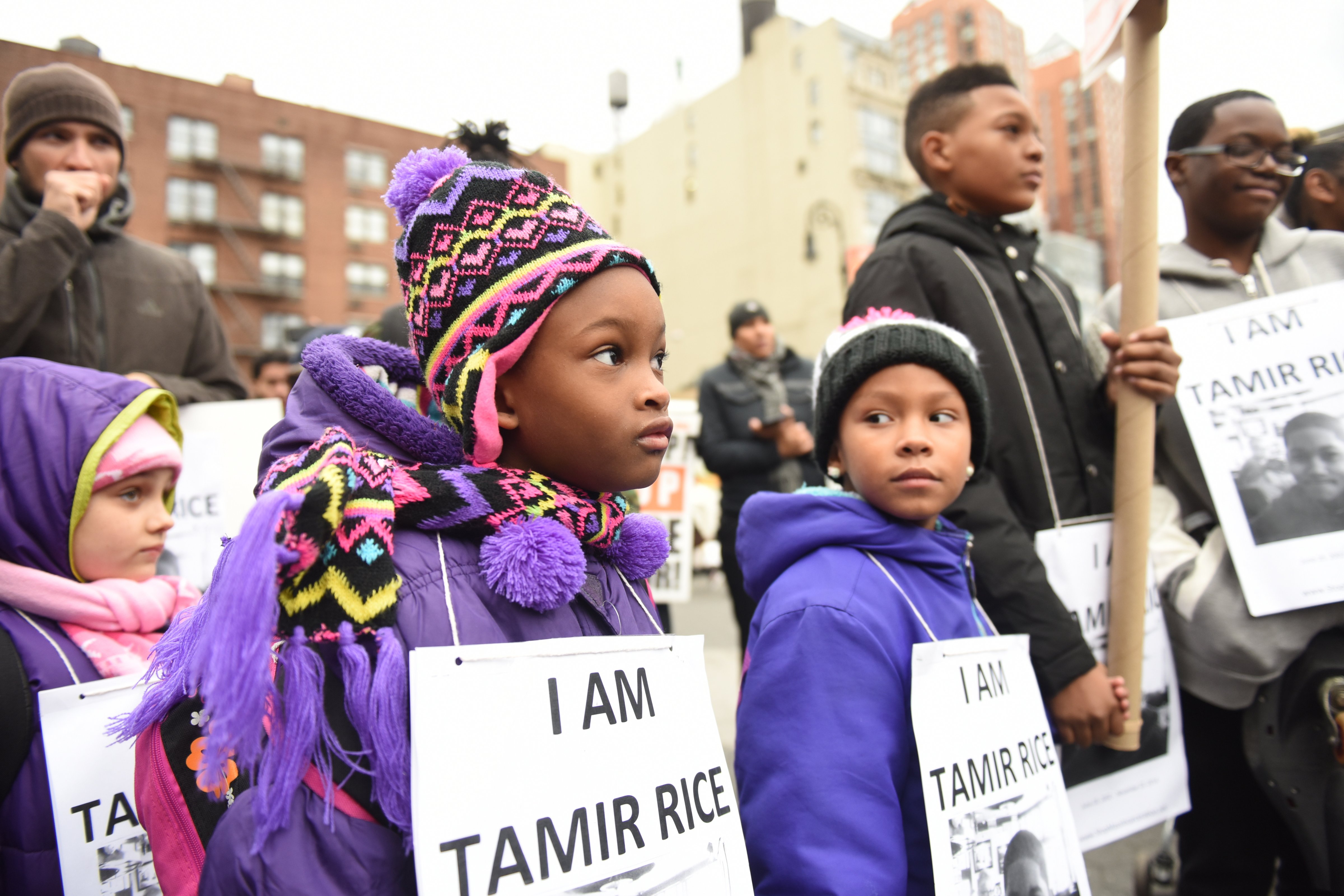 Children wear <i>I Am Tamir Rice</i> signs at a Stop Mass Incarcerations Network sponsored march demanding accountability on the one year anniversary of Tamir Rice's death at the hands of the Cleveland police in New York City on Nov. 22, 2015. (Andy Katz—Pacific Press/LightRocket/ Getty Images)