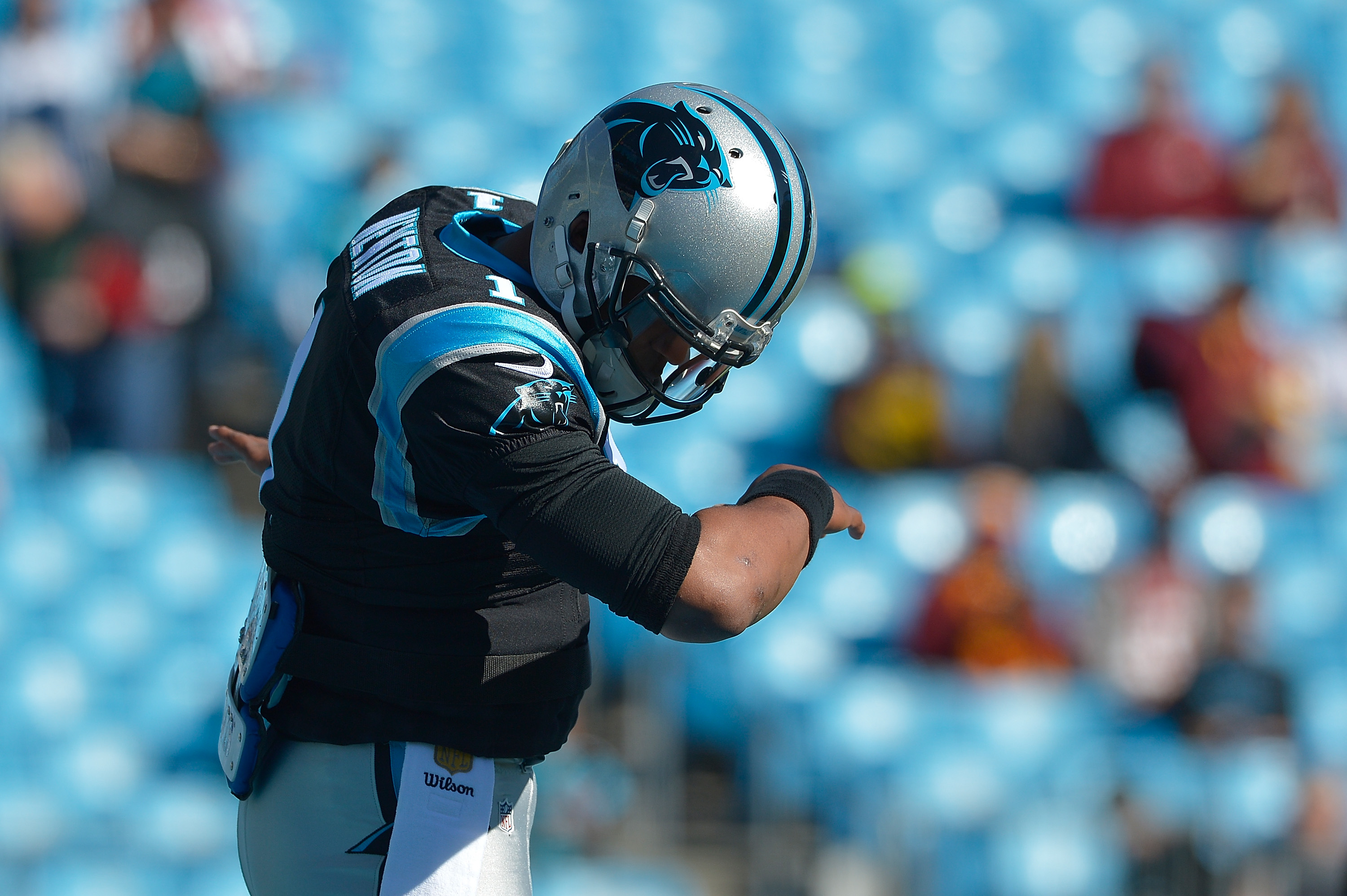 Cam Newton #1 of the Carolina Panthers dances The Dab as he warms up during their game against the Washington Redskins at Bank of America Stadium on November 22, 2015 in Charlotte, North Carolina. The Panthers won 44-16. (Grant Halverson&mdash;Getty Images)