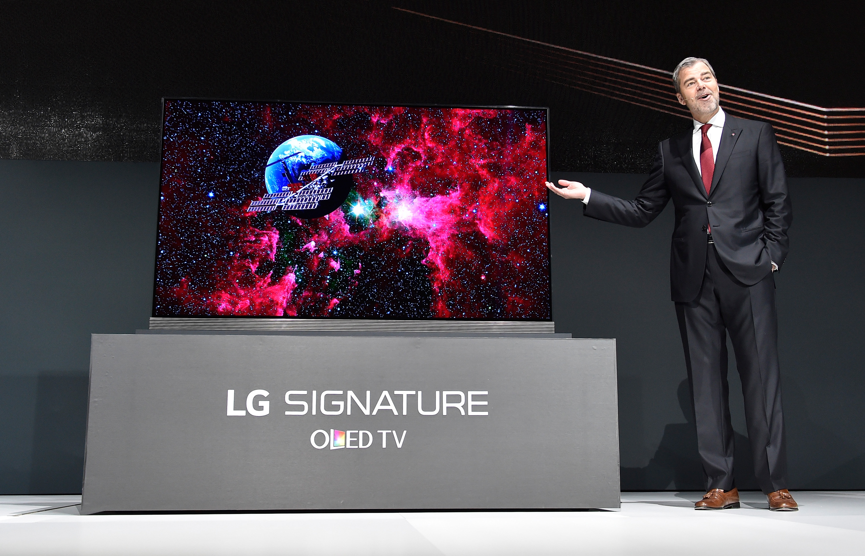 LG Electronics USA Vice President of Marketing David VanderWaal gestures as he displays the LG Signature 77 inch 4K HDR-enabled OLED TV during a press event for CES 2016 at the Mandalay Bay Convention Center on January 5, 2016 in Las Vegas, Nevada. (David Becker&mdash;Getty Images)