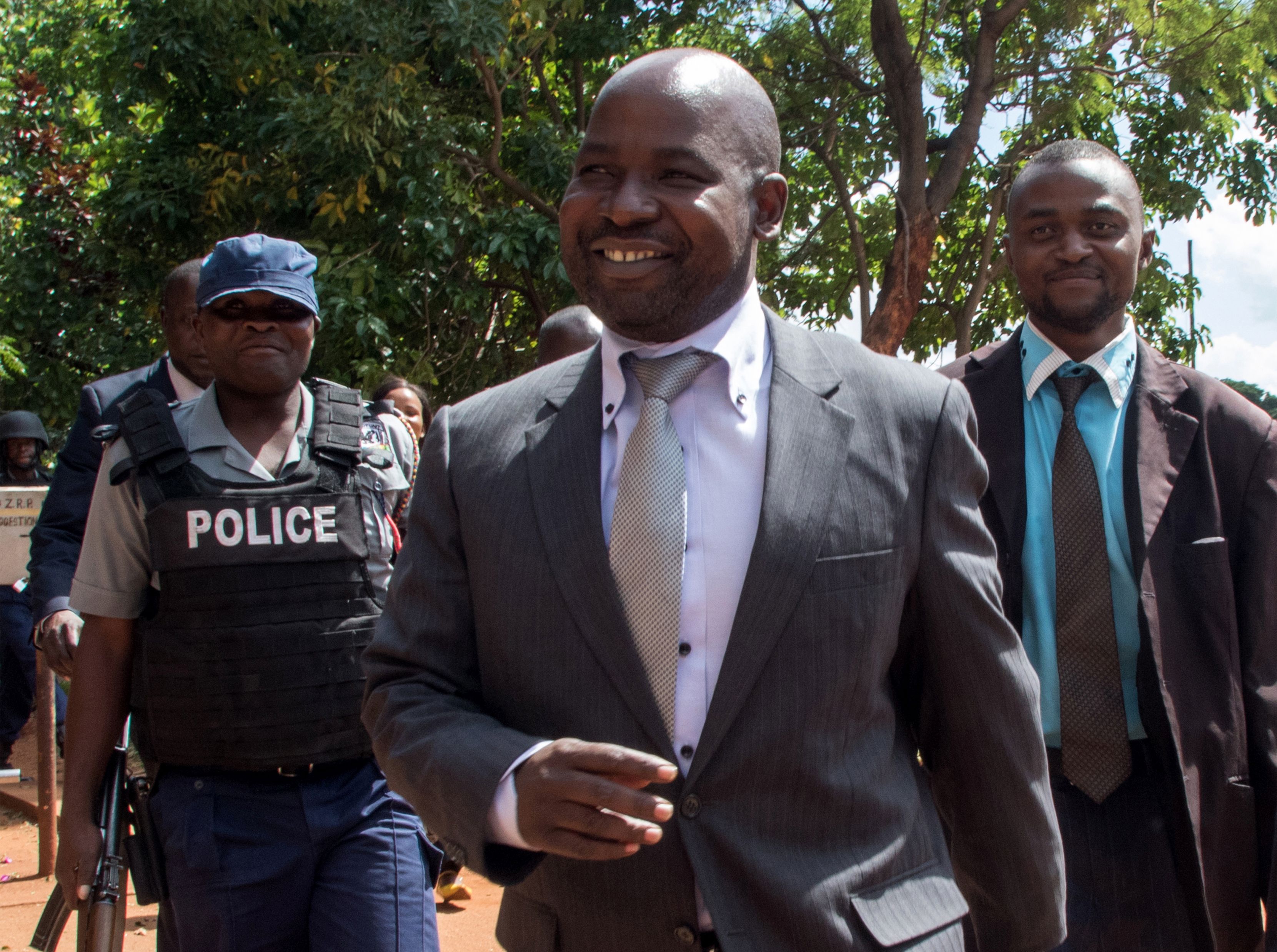Zimbabwe's chief prosecutor Johannes Tomana (C) arrives at the Harare Magistrates court in Zimbabwe, on Feb. 2, 2016 (Jekesai Njikozana—AFP/Getty Images)