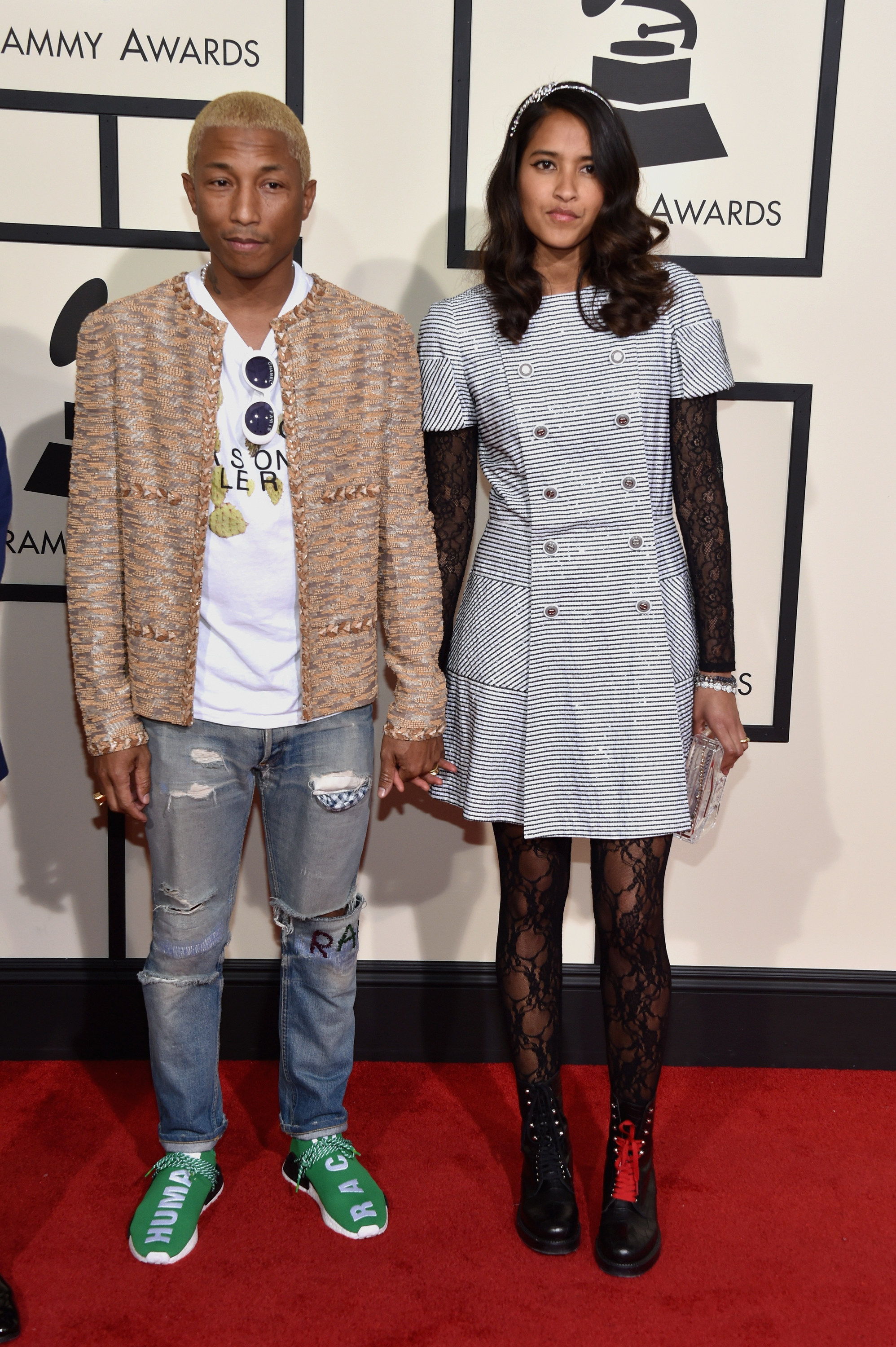 Pharrell Williams, left, and Helen Lasichanh, right, attend the 58th GRAMMY Awards at Staples Center on Feb. 15, 2016 in Los Angeles.