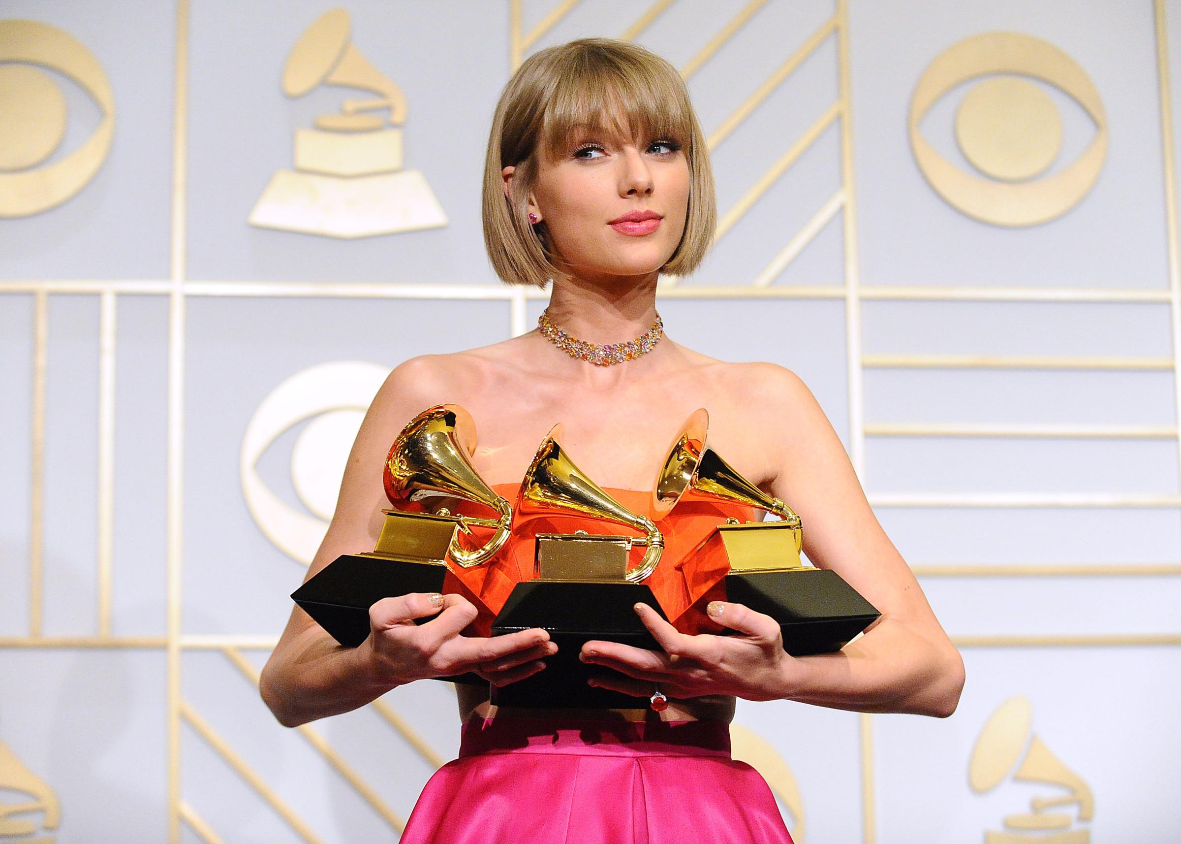 Taylor Swift poses in the press room at the The 58th Grammy Awards on Feb. 15 in Los Angeles.