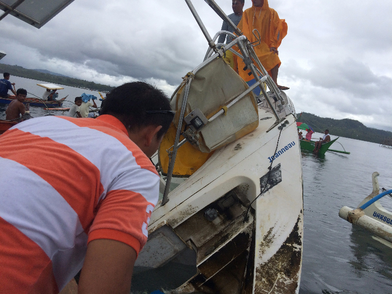Filipino fishermen recovering a drifting yacht in the seas off the Philippine town of Barobo, in Surigao del Sur province, on Feb. 27, 2016 (Barobo Police Handout//EPA)