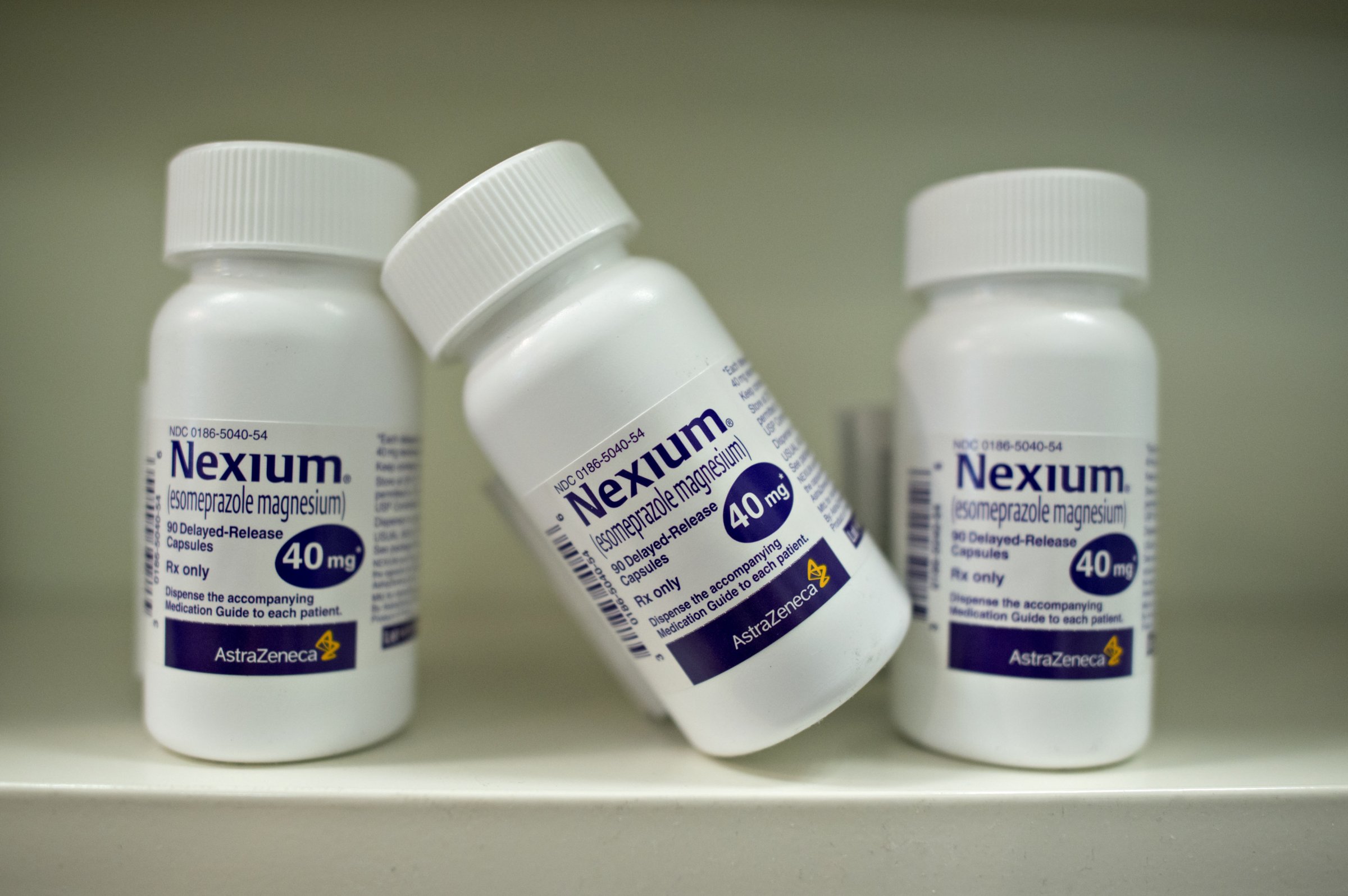 Bottles of AstraZeneca Plc's Nexium heartburn medication are arranged for a photograph at a pharmacy in Princeton, Illinois, U.S., on Wednesday, Aug. 20, 2014.